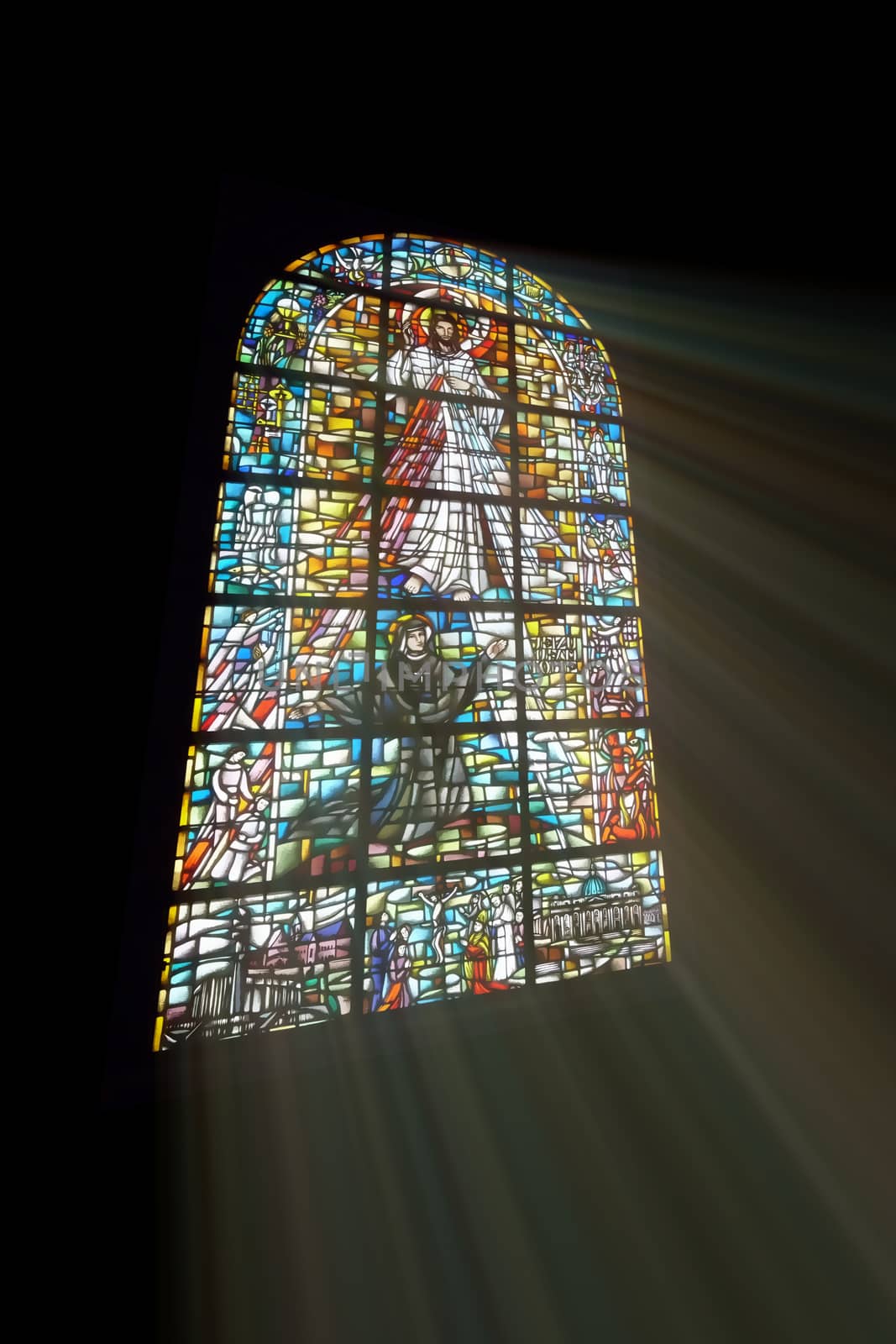 Biblical stained glass with rays of light shining through