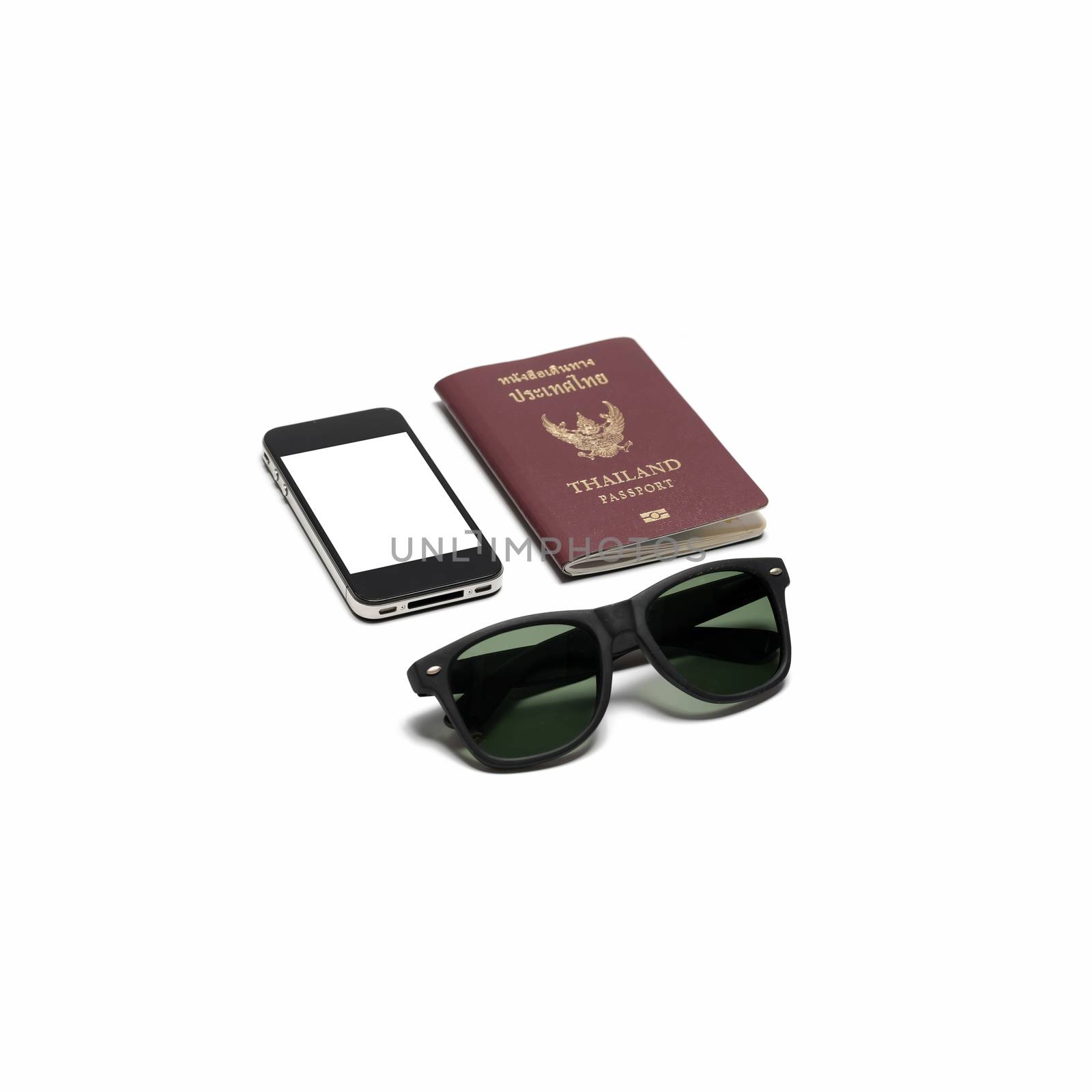 passport smartphone and sun glasses isolated on white background