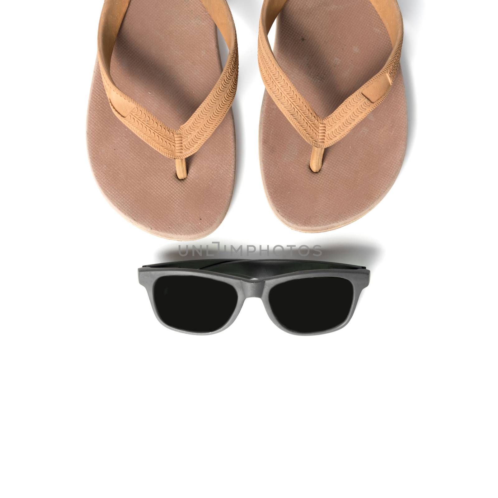 sunglasses and slippers isolated on white background