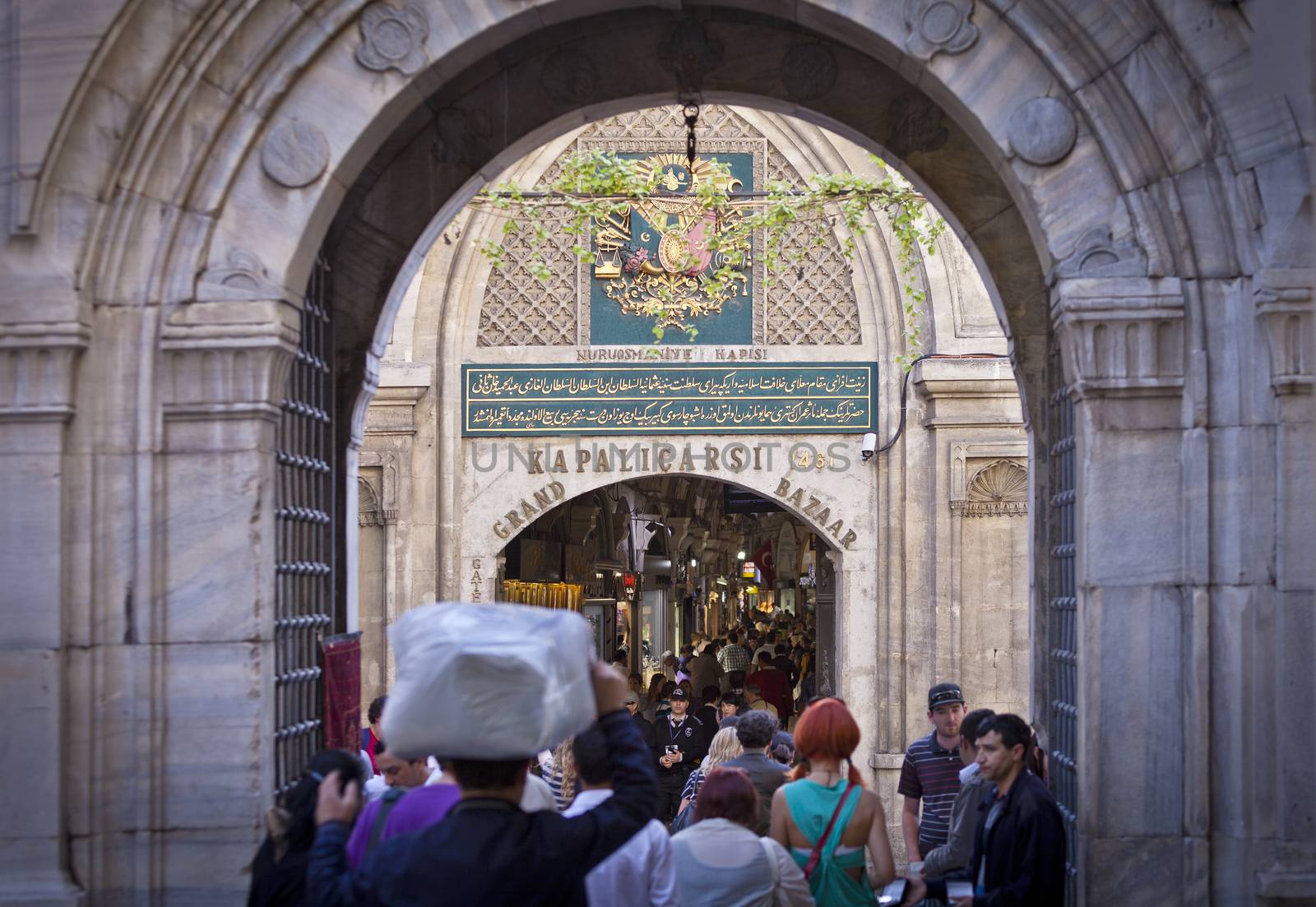 ISTANBUL, TURKEY – APRIL 26: Entrance to the busy Grand Bazaar in Istanbul with tourists and local Turkish people prior to Anzac Day on April 26, 2012 in Istanbul, Turkey. 