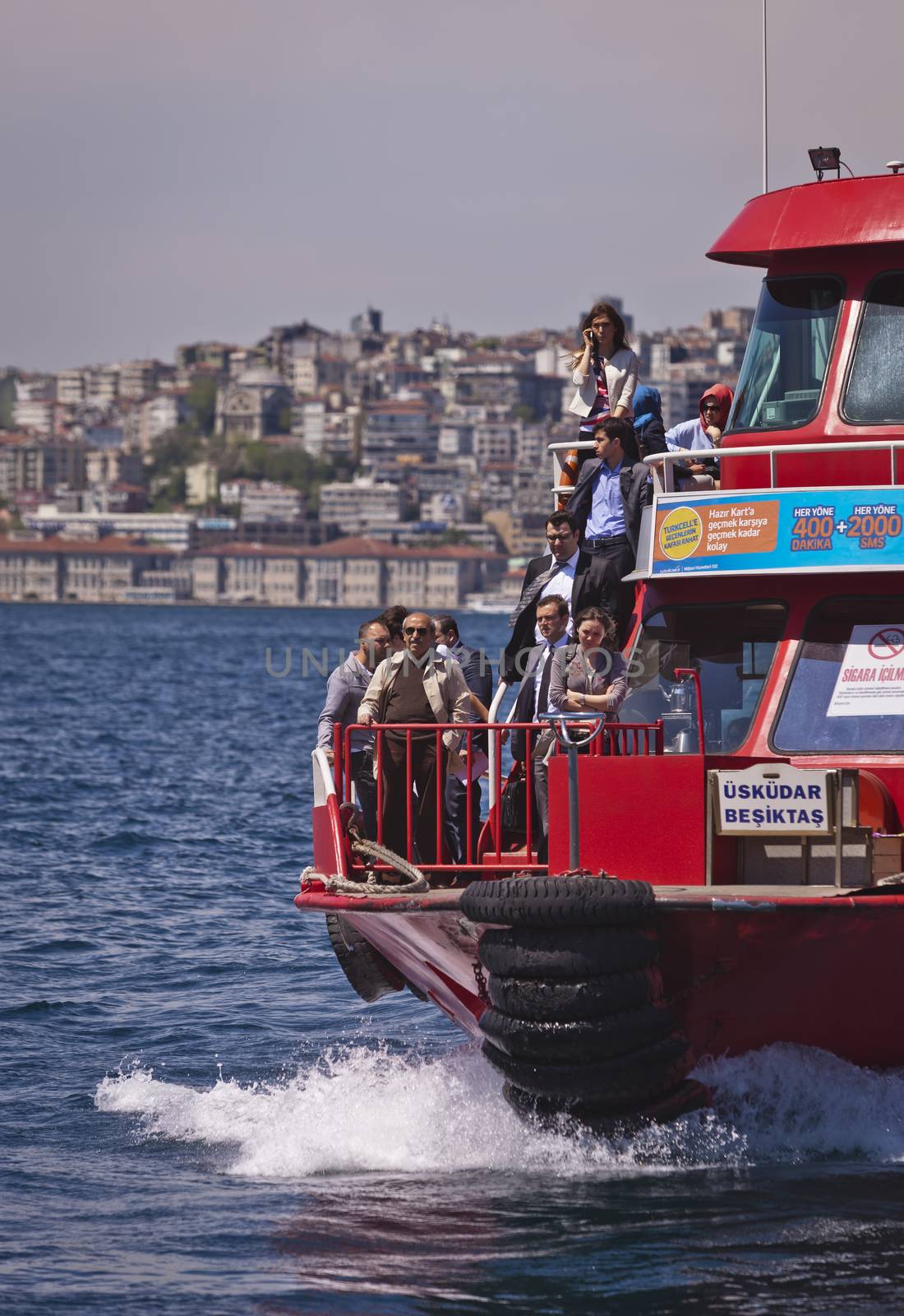 ISTANBUL, TURKEY – APRIL 27: Turkish people cross the Bosphorus on a transportation ferry prior to Anzac Day on April 27, 2012 in Istanbul, Turkey. 