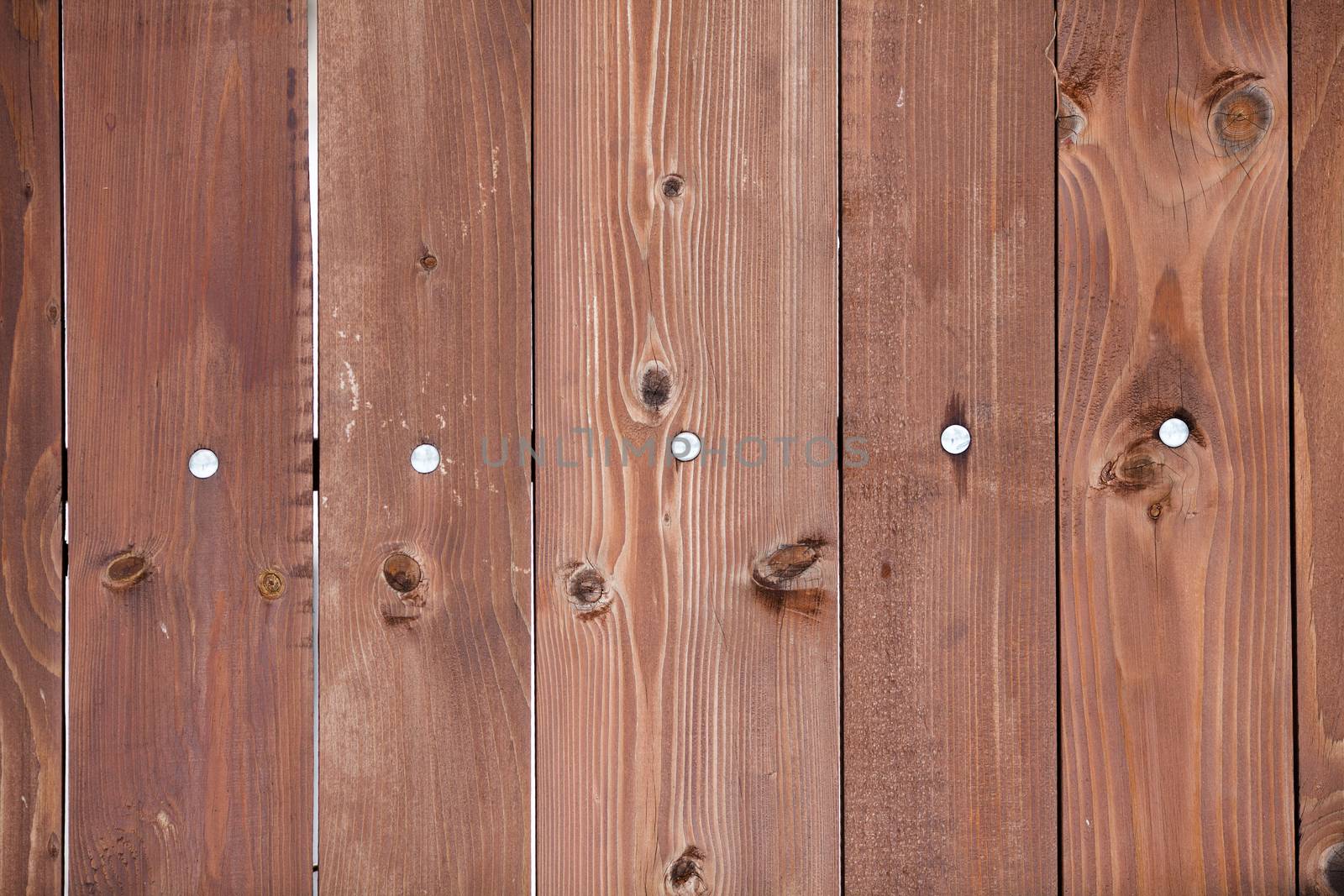 Natural wooden background with nails