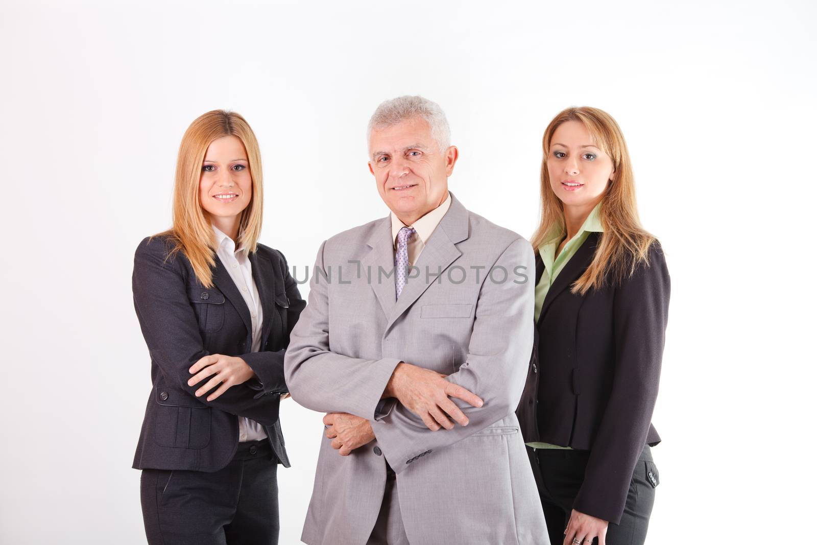 Successful Senior Manager with two female colleagues. White background