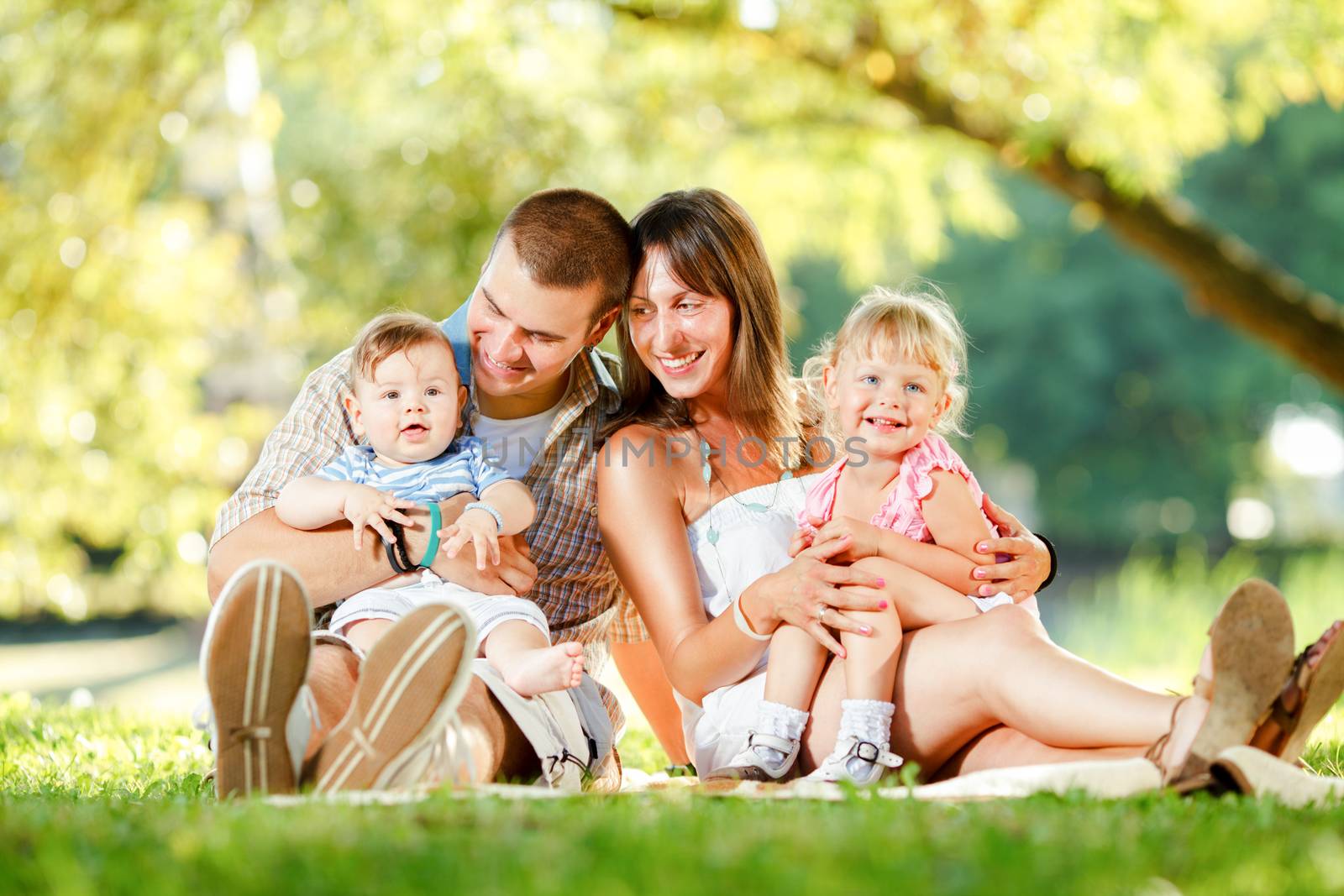 Beautiful happy family enjoying in the park