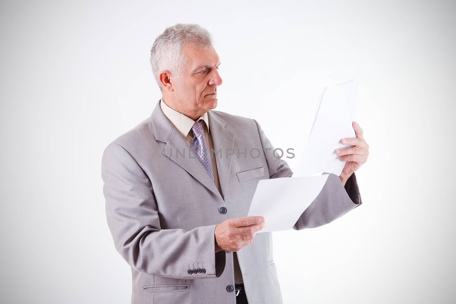 Senior Businessman looking at documents