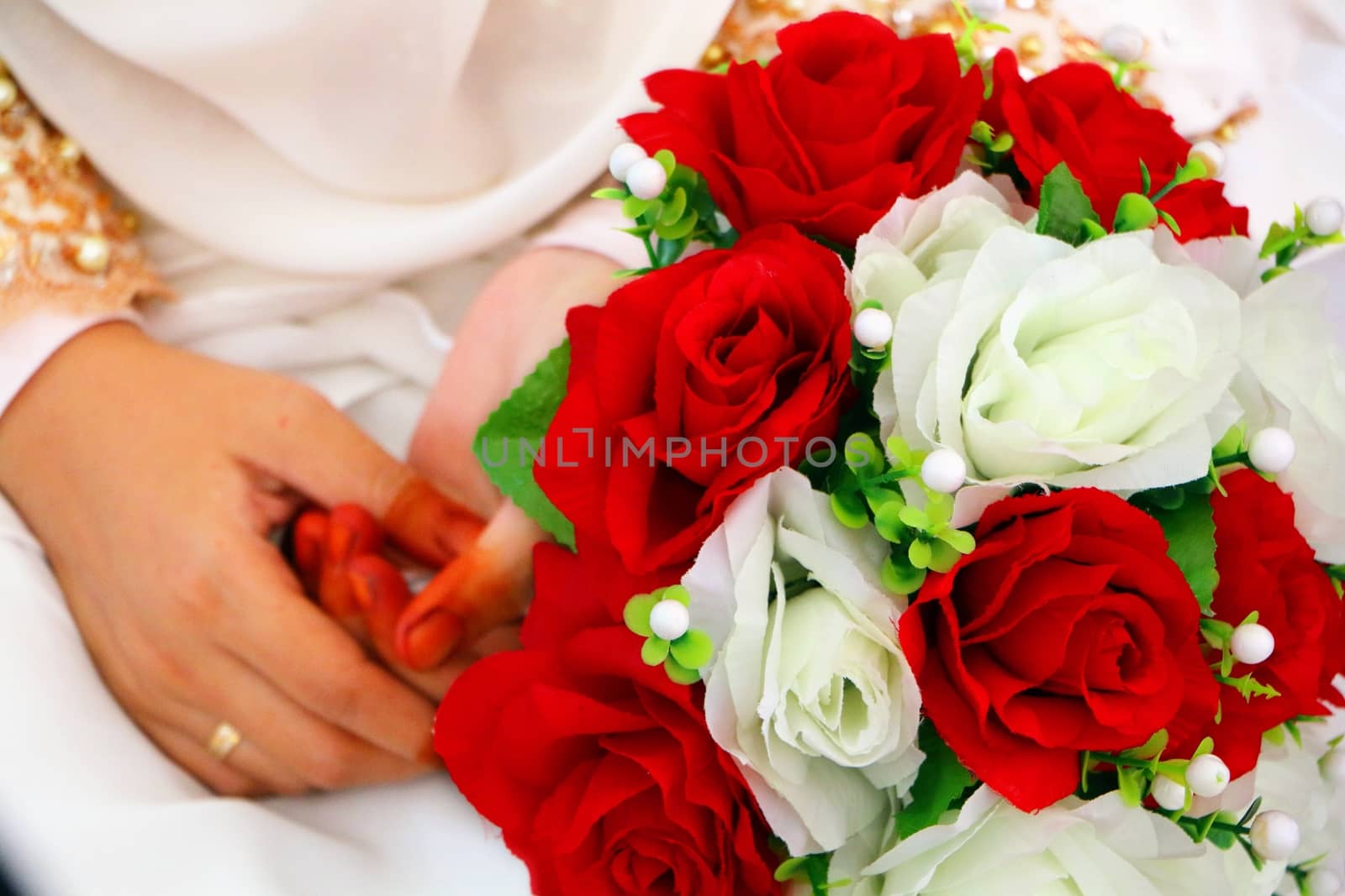 Wedding bouquet at bride's hands by razihusin