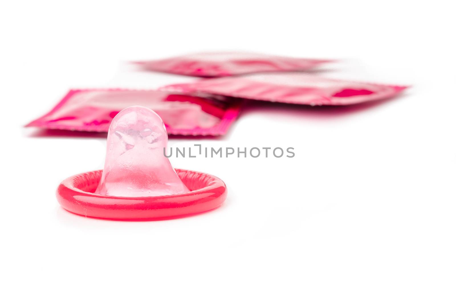 Condom packaging on white background.