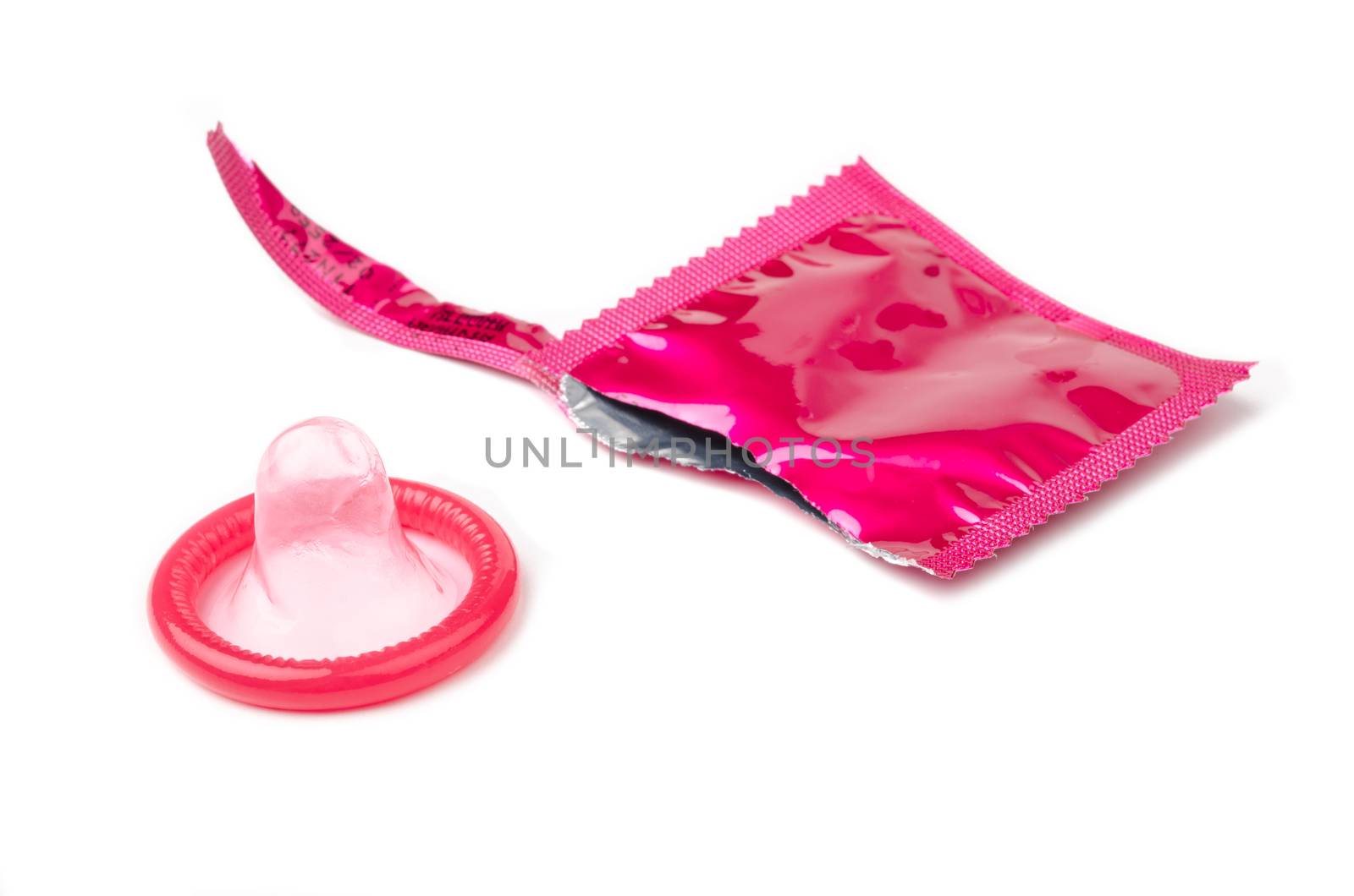 Condom packaging on white background.