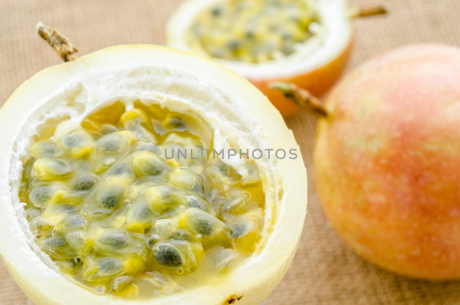 The fresh Passion fruits on sack background.