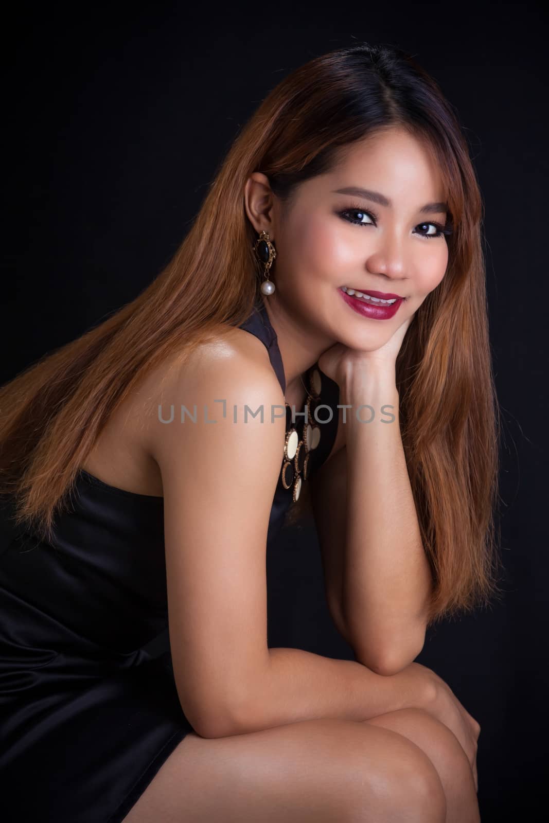 Portrait of young Asian girl - black dress