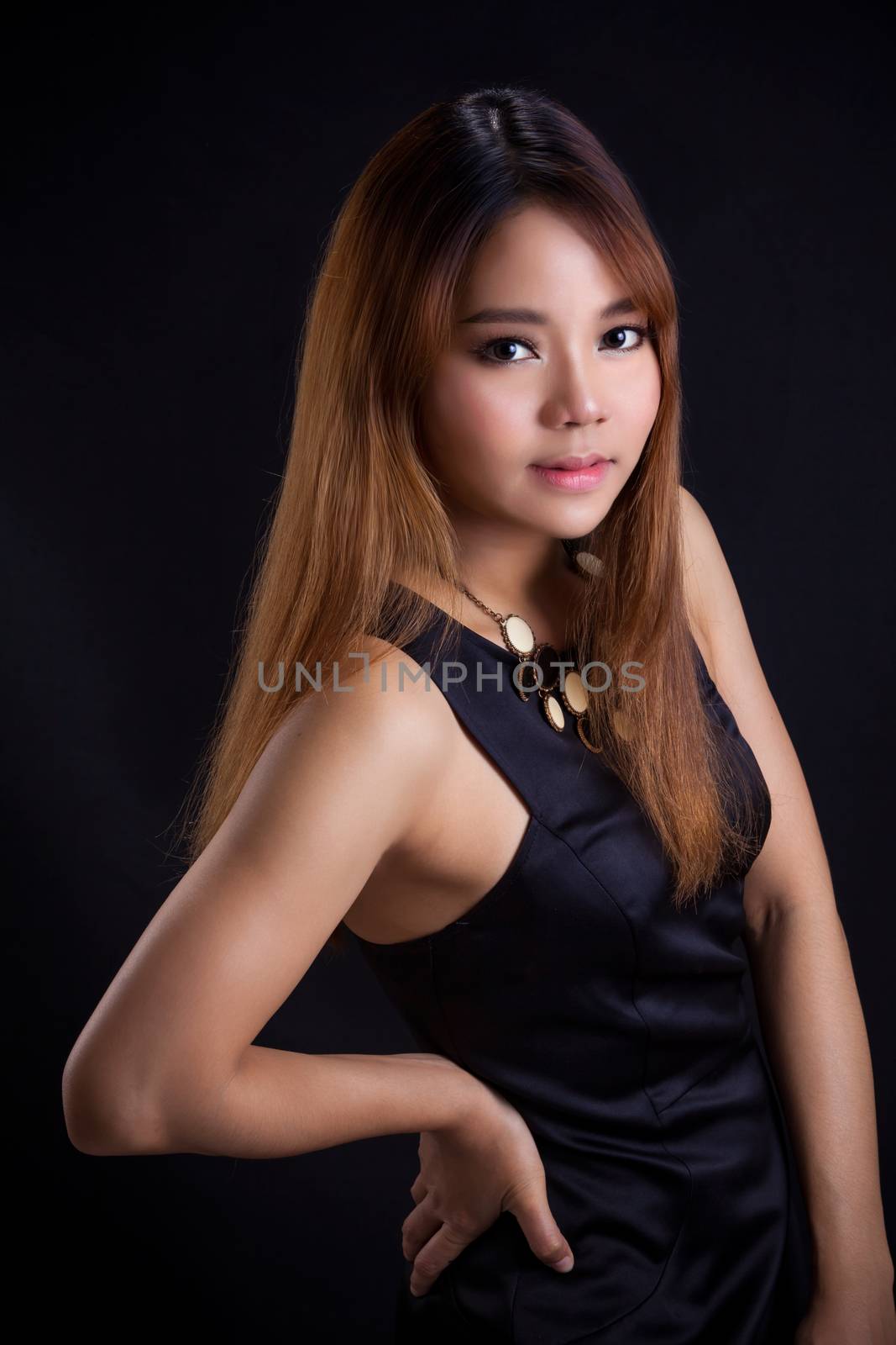 Portrait of young Asian girl - black dress