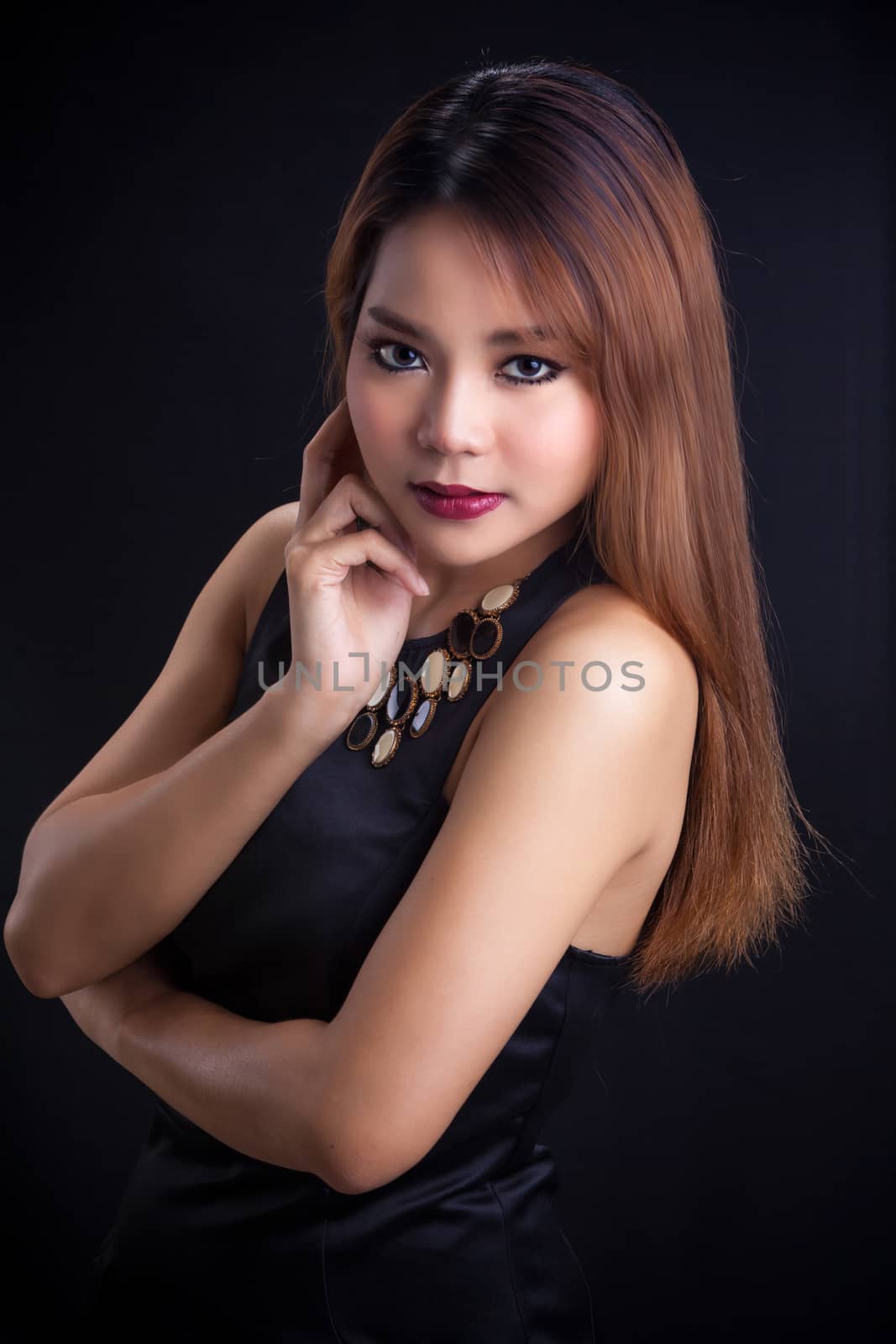 Portrait of young Asian girl - black dress