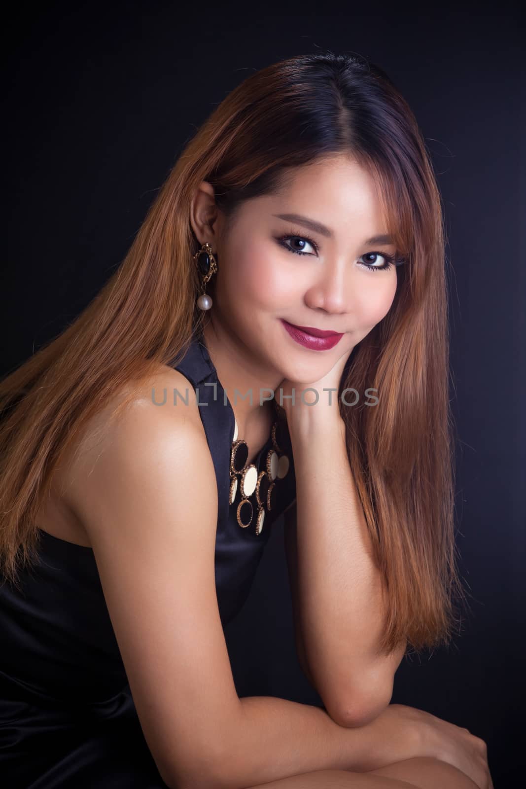 Portrait of young Asian girl - black dress