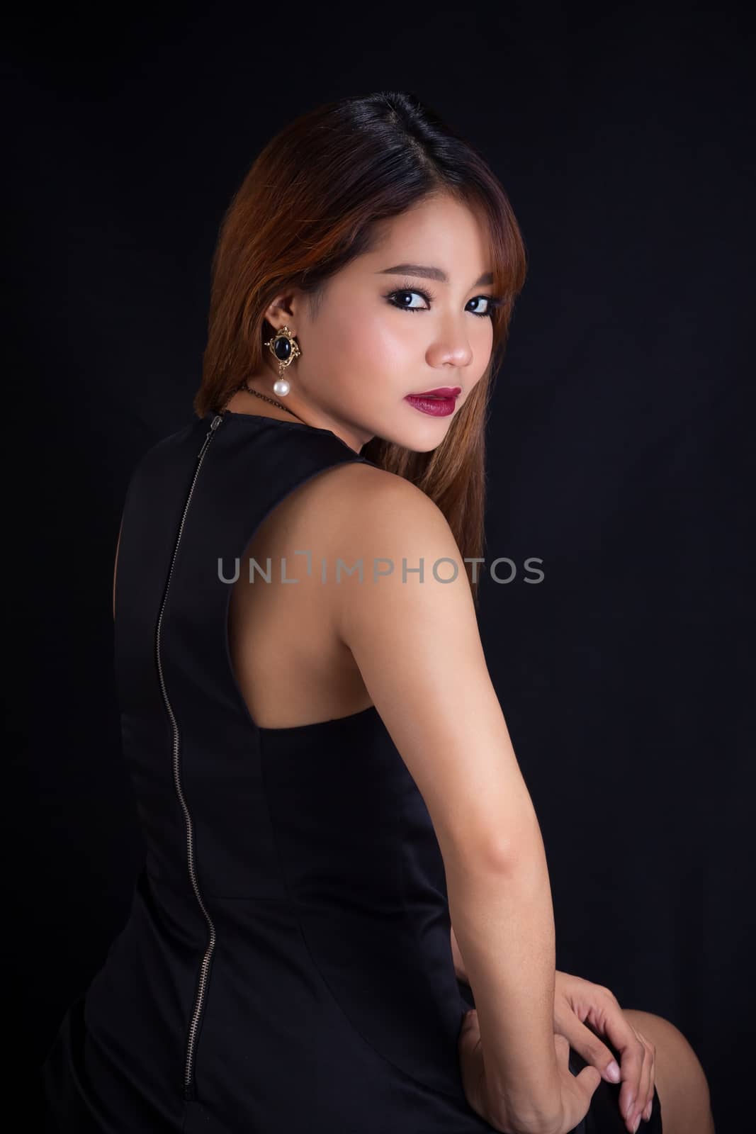 Portrait of young Asian girl - black dress