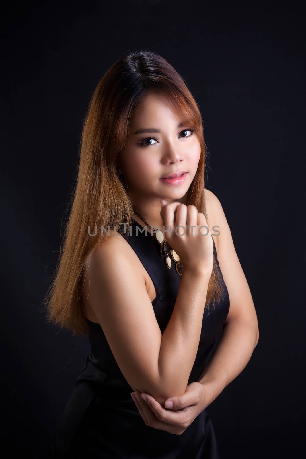 Portrait of young Asian girl - black dress