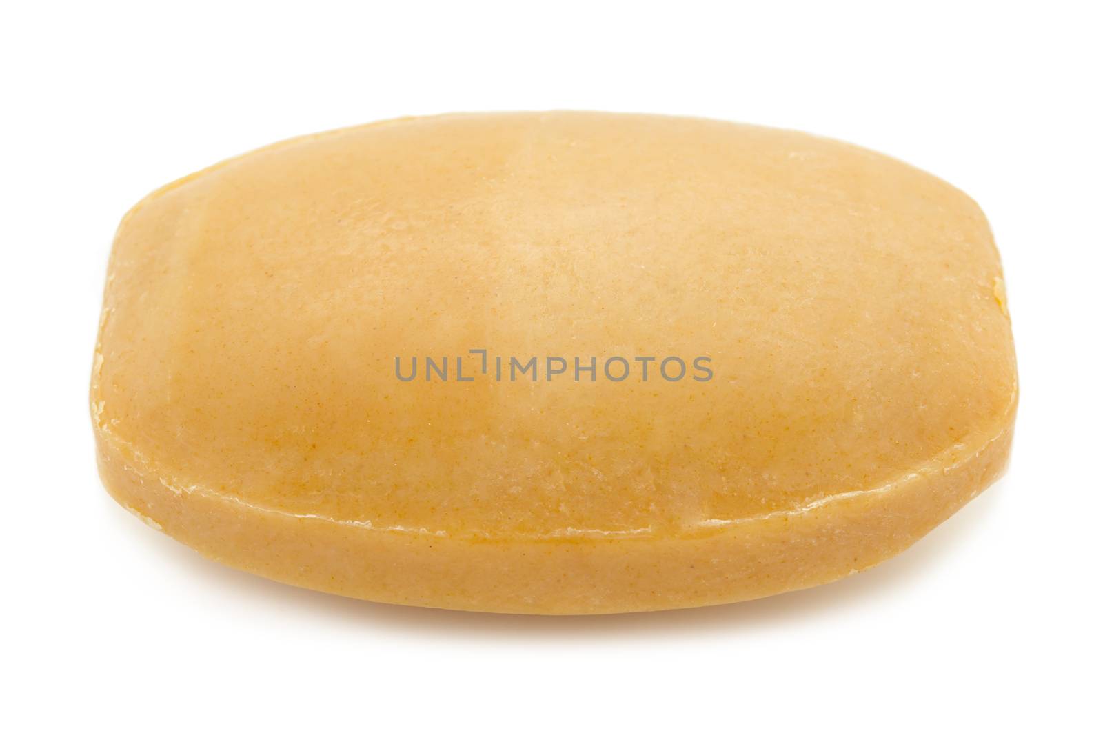 Bar of natural brown turmeric soap isolated on white