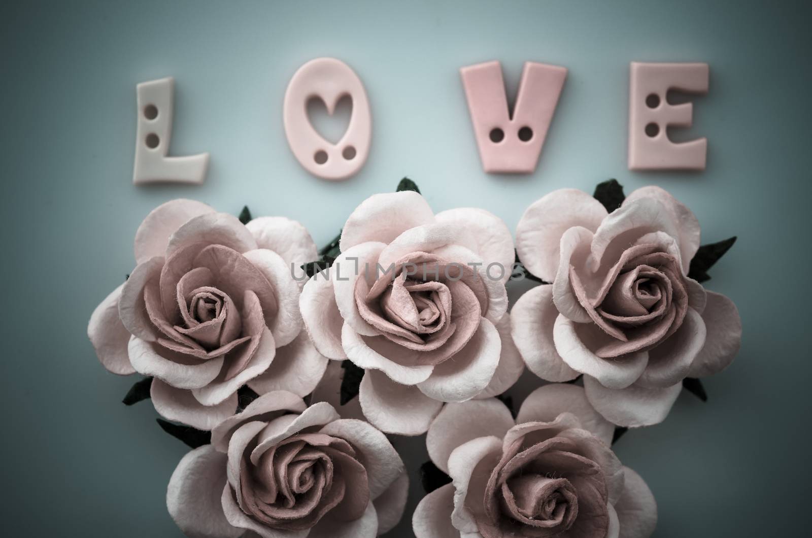 Vintage pink roses flower and love text. by Gamjai