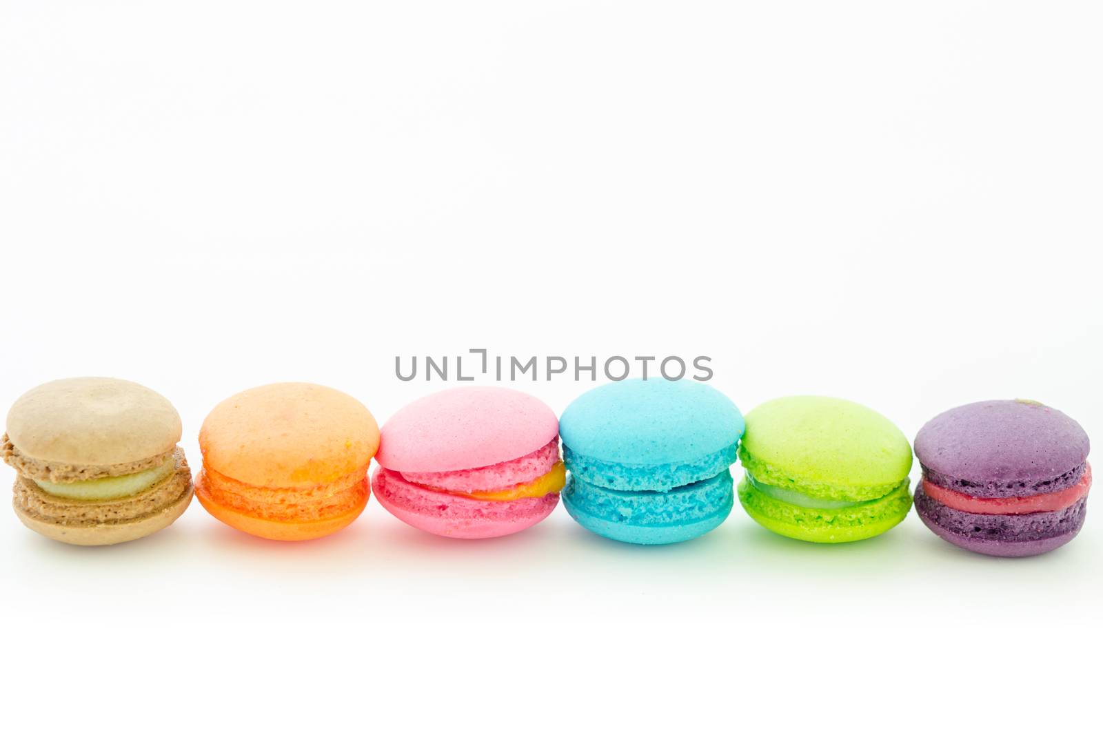Colorful macaroons on white. by Gamjai