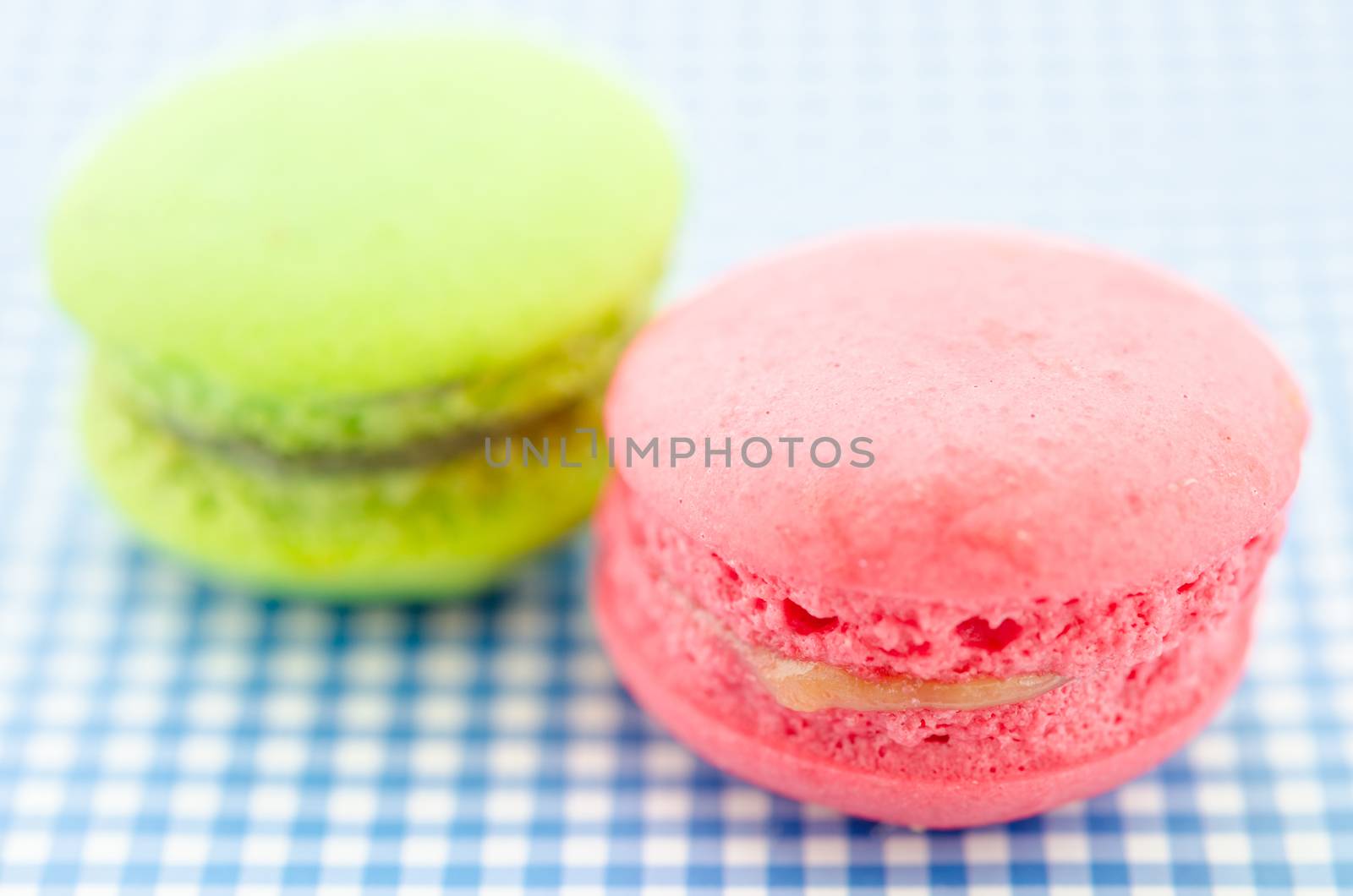 colorful macaroon sweet tasty dessert on tablecloth.
