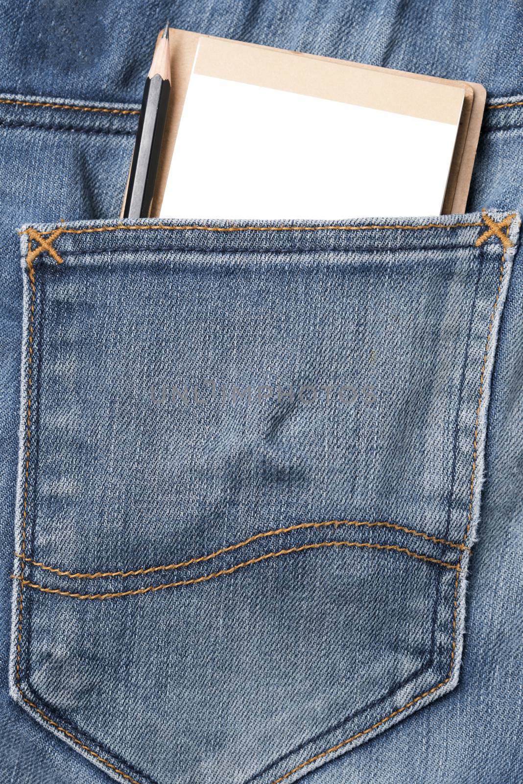 notebook and pencil in jean pocket
