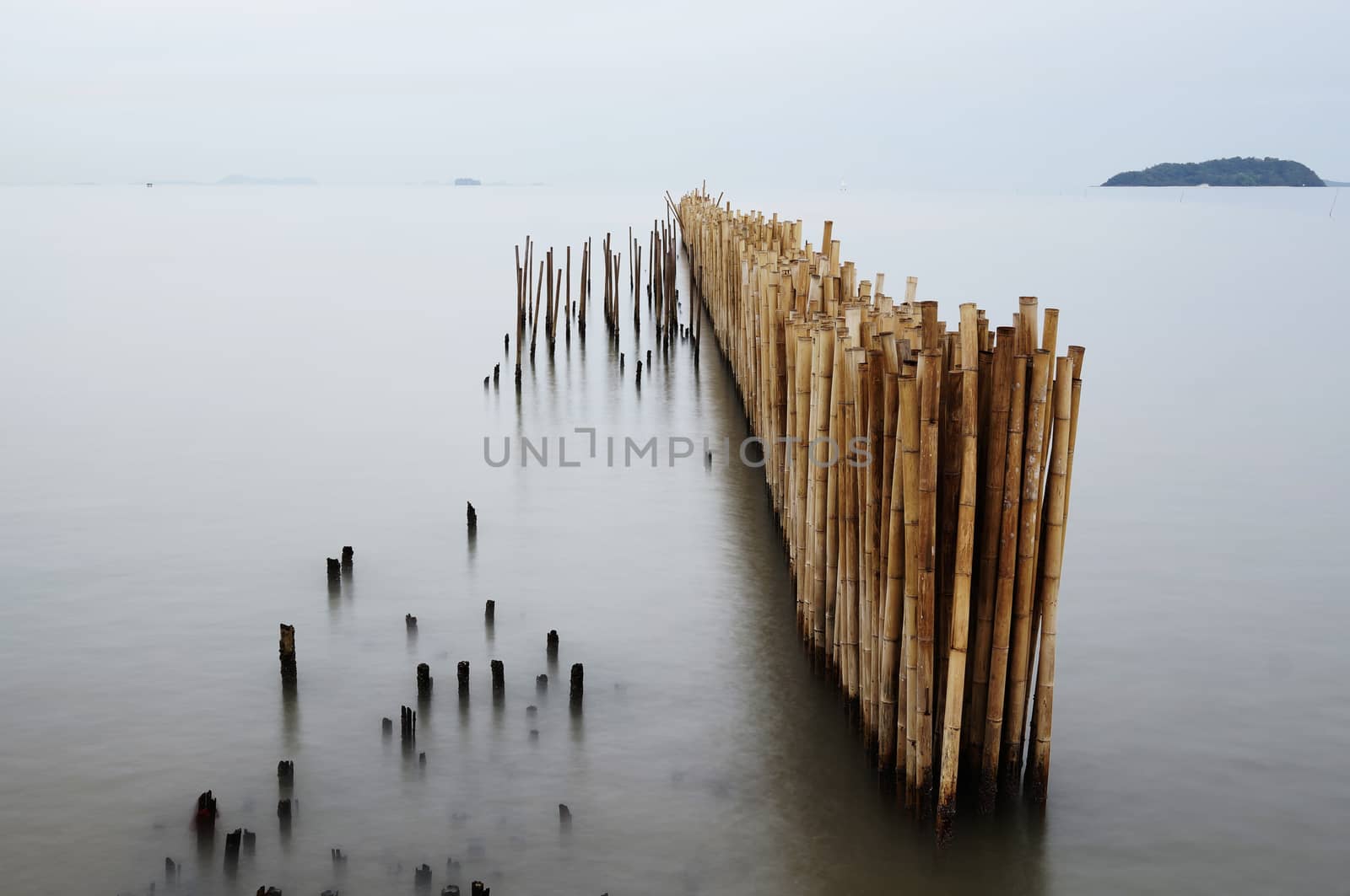 Found the bamboo partition in the beach of Phuket, this is use for separate the water from river to the sea, to make sure the water near by the beach was not pollution. Take it by long exposure.