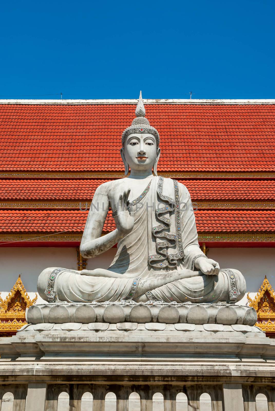 Big buddha image statue sitting at thai temple.