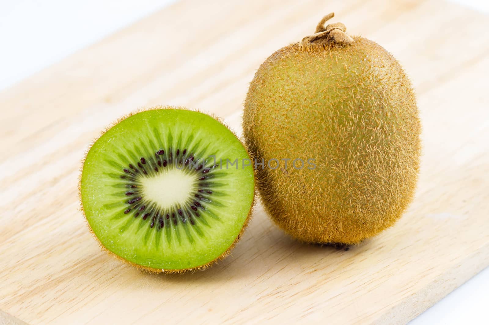 Fresh kiwi fruits on wooden. Wood background.