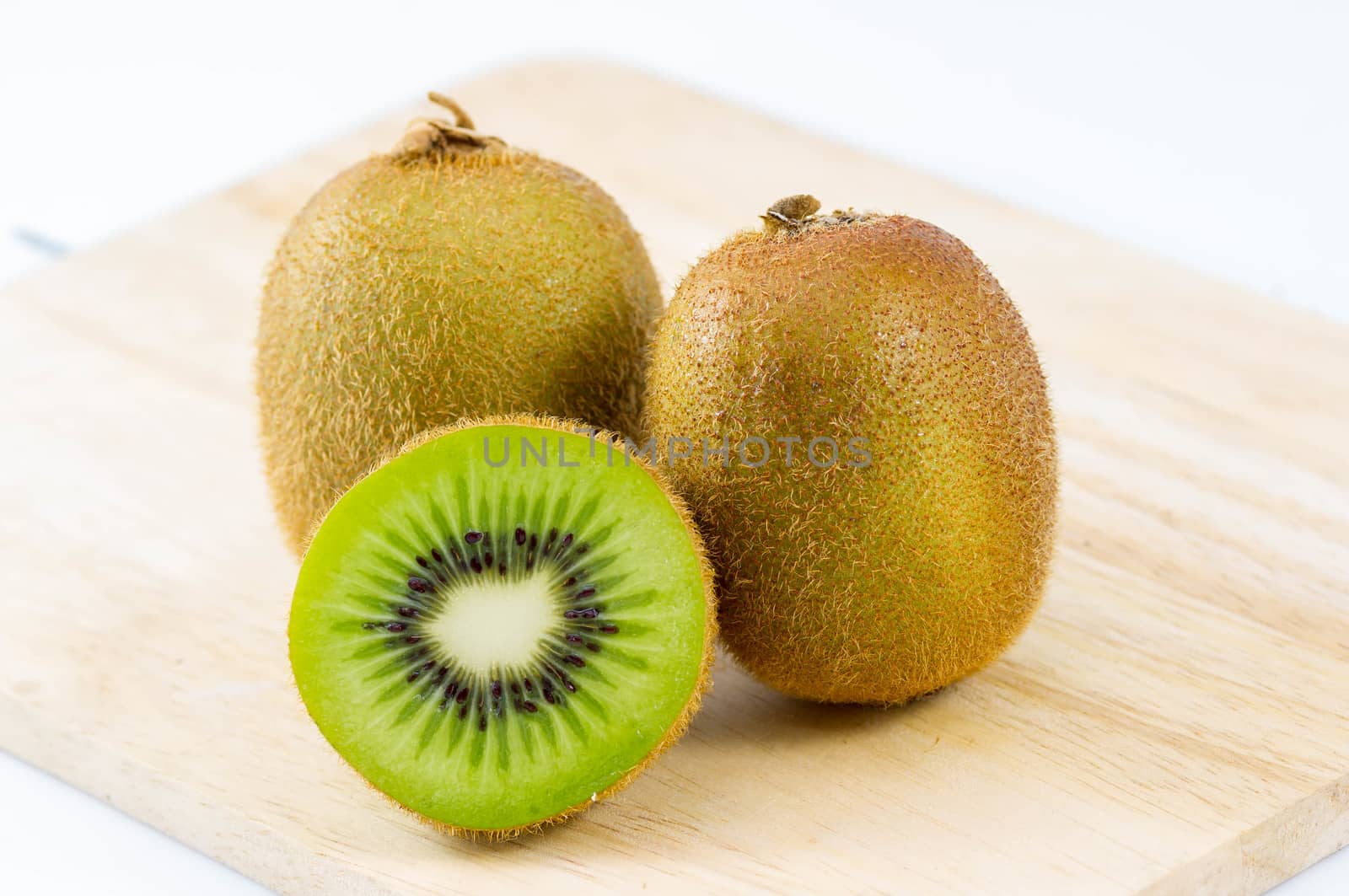 Fresh kiwi fruits on wooden. Wood background.