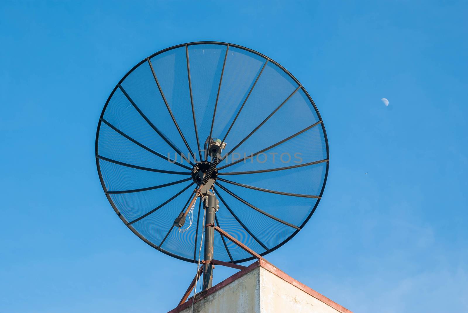 Satellite dish antenna on blue sky and cloud.