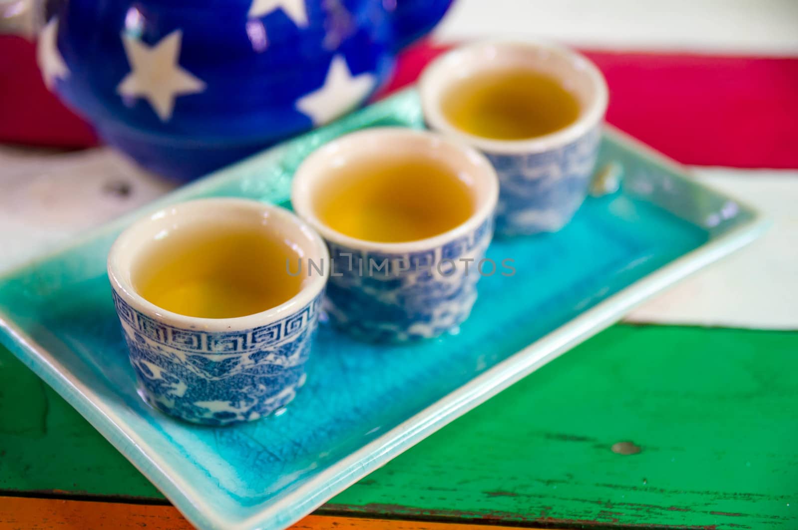 China tea/ Chinese style herbal floral tea over wood table.