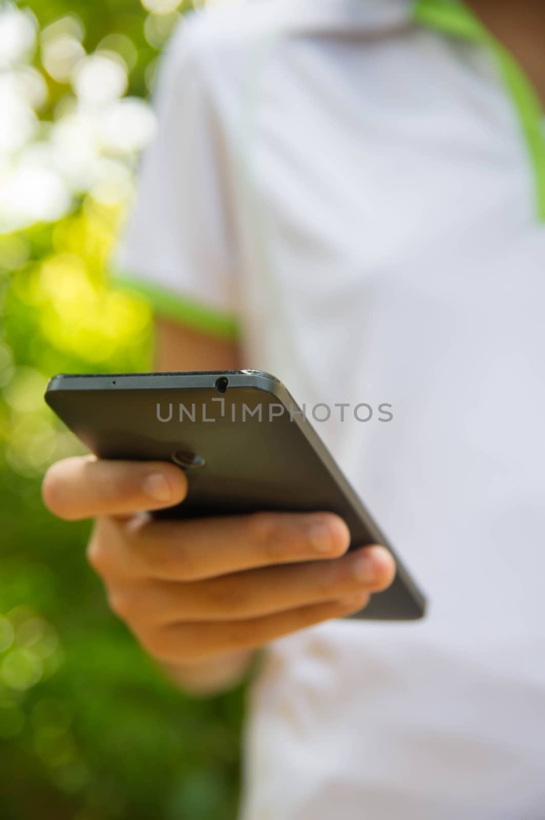 Close up of a girl using mobile smartphone.