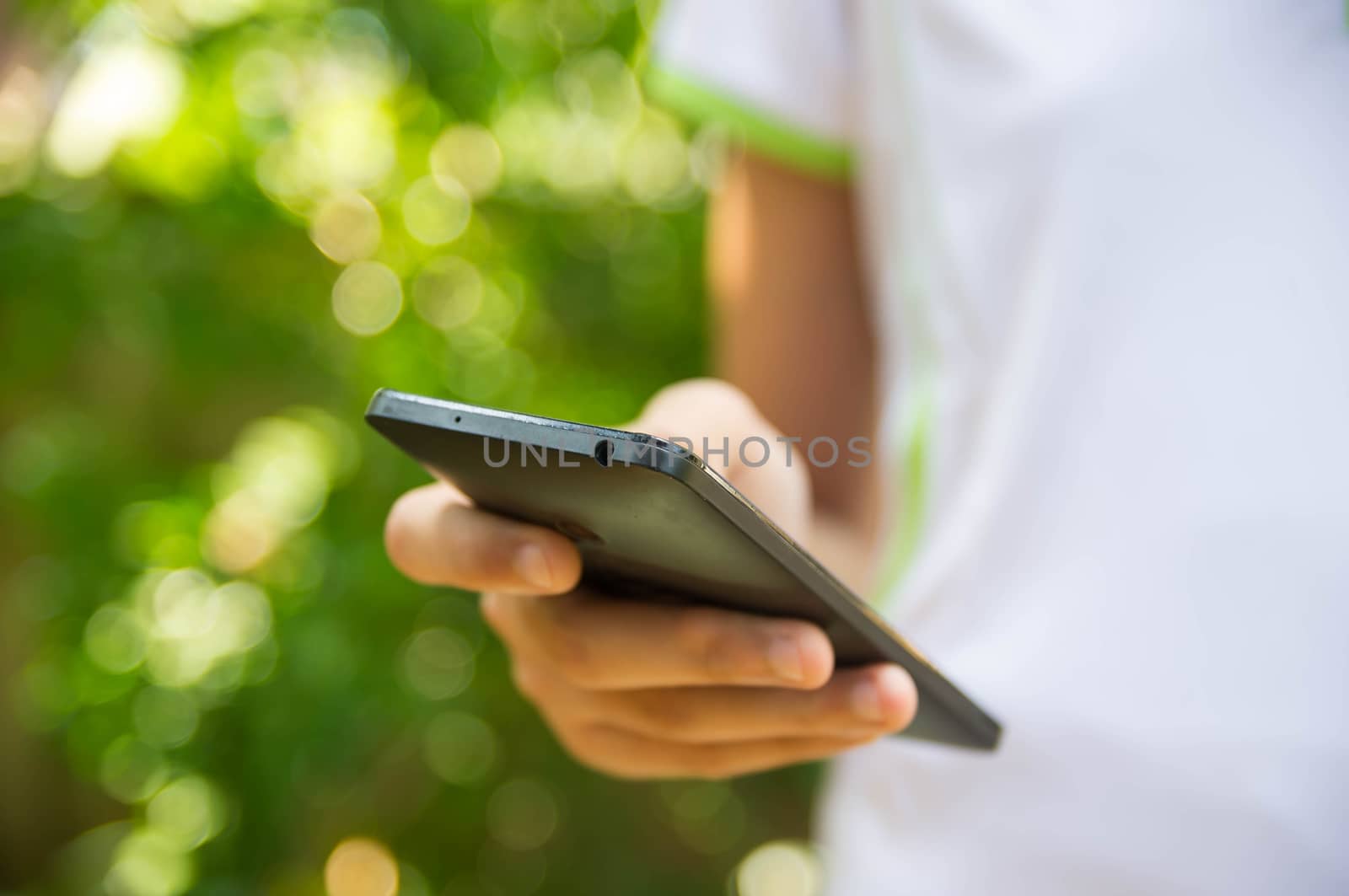 Close up of a girl using mobile smartphone.