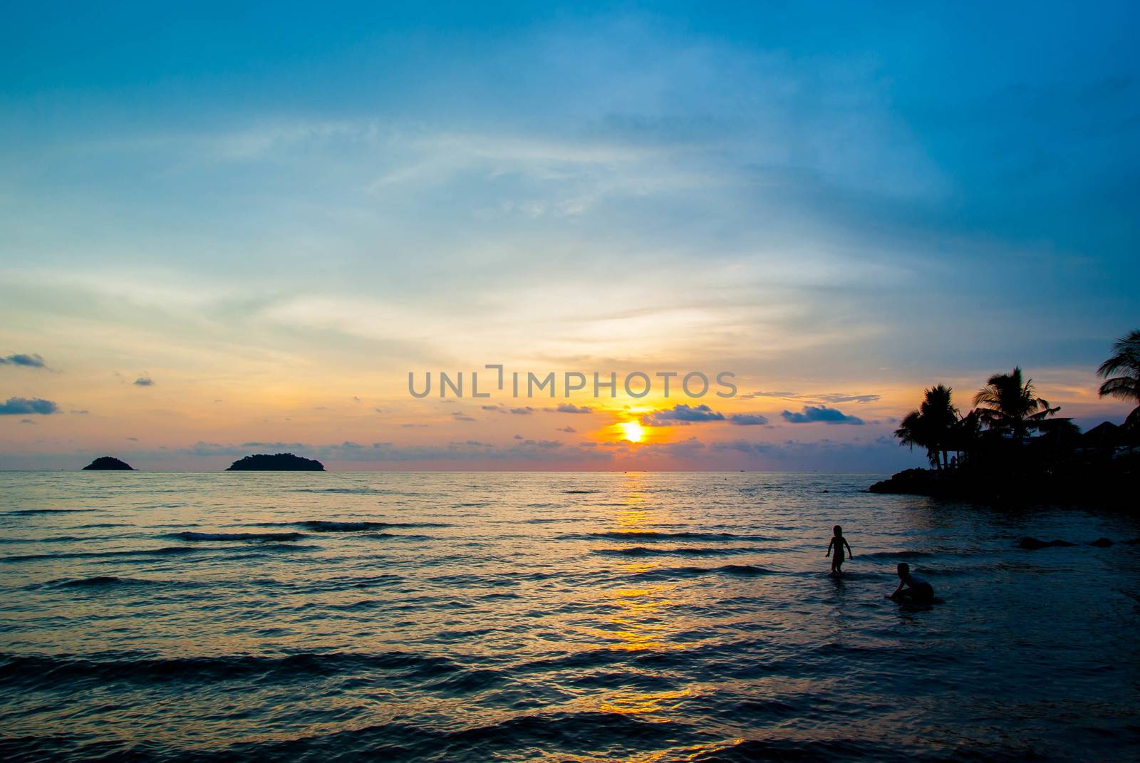 sunset on the beach by seksan44