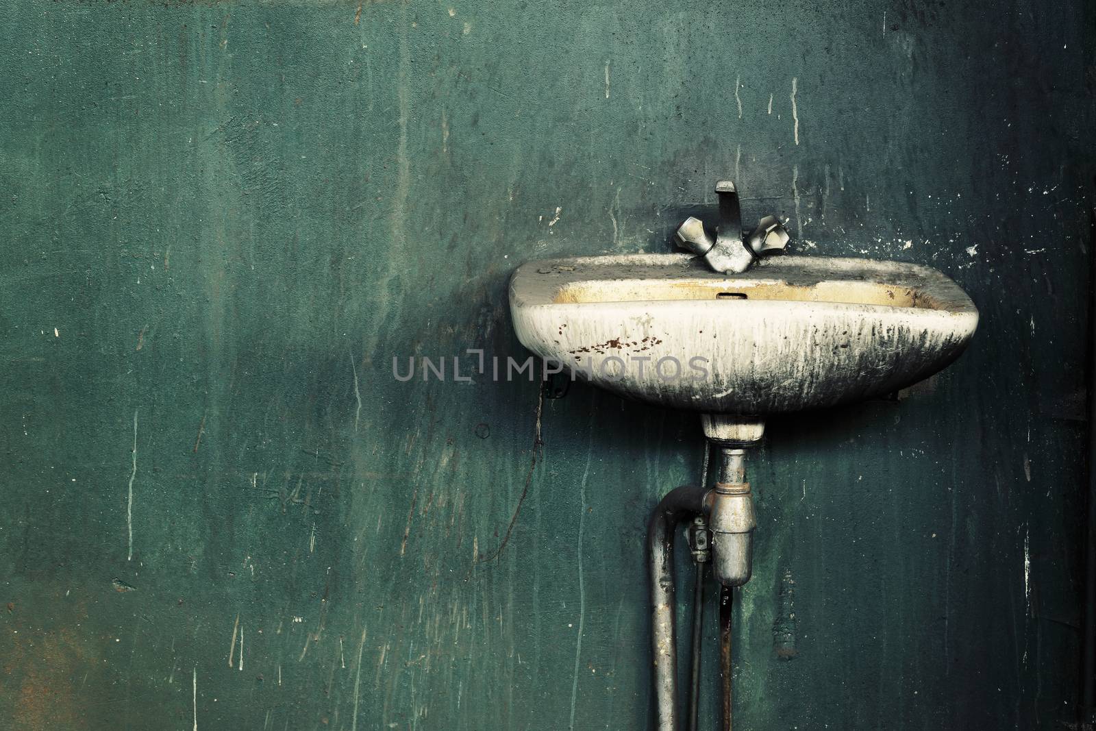 Old dirty sink in an abandoned factory.