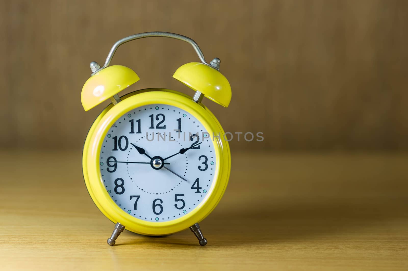 Vintage background with retro alarm clock on table