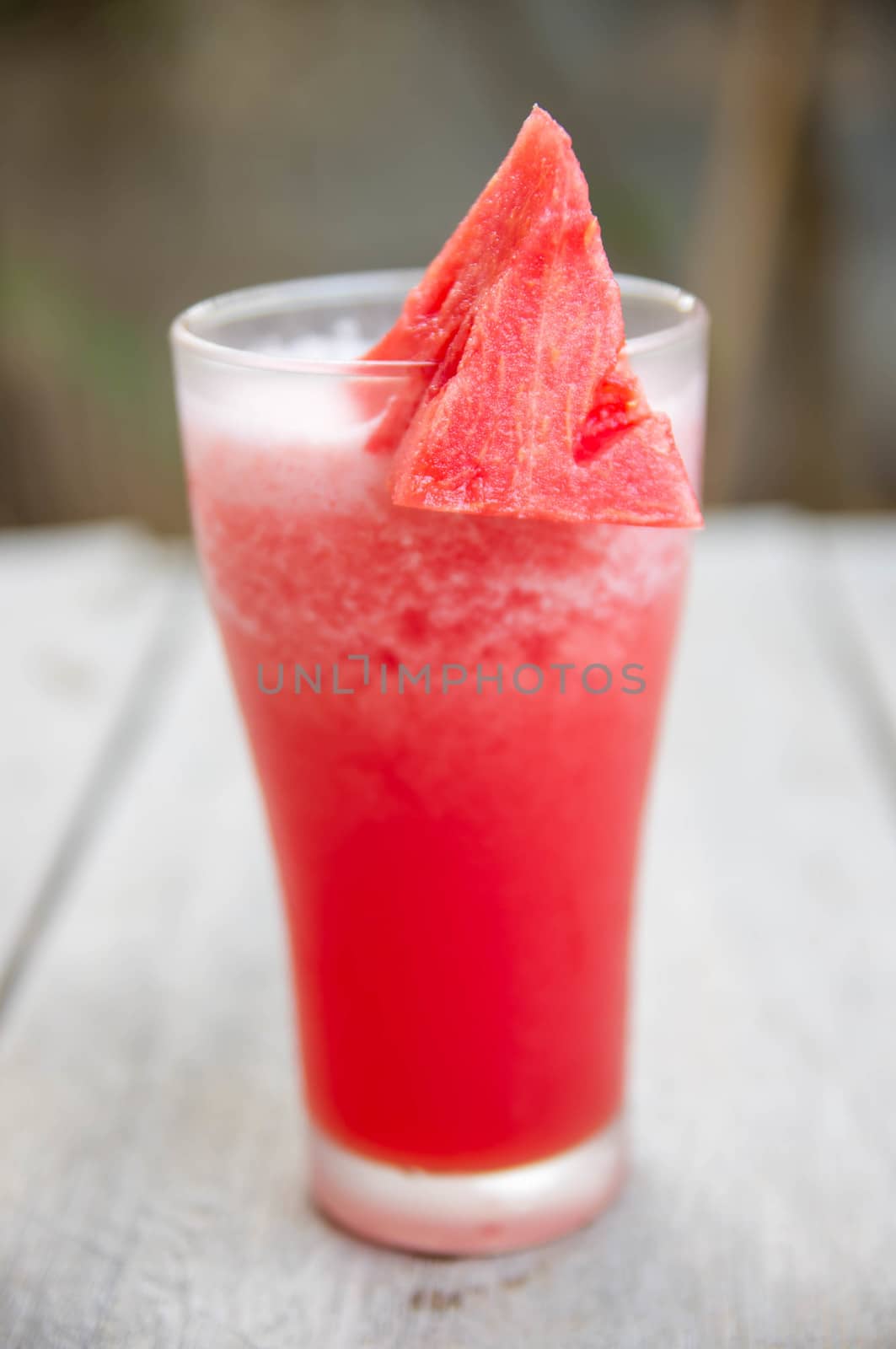 Smoothie water melon with slice water melon on wooden table.