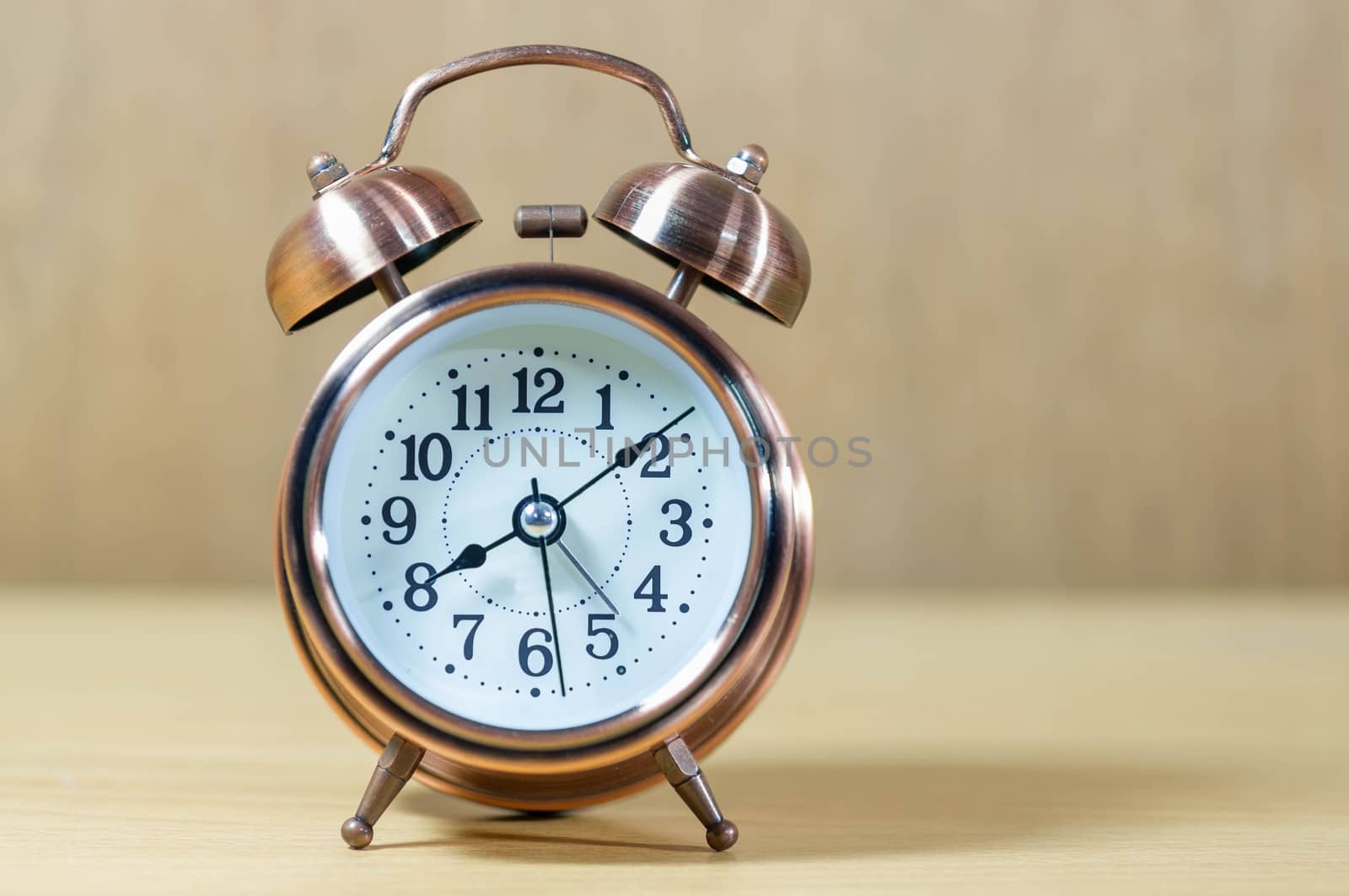 Vintage background with retro alarm clock on table