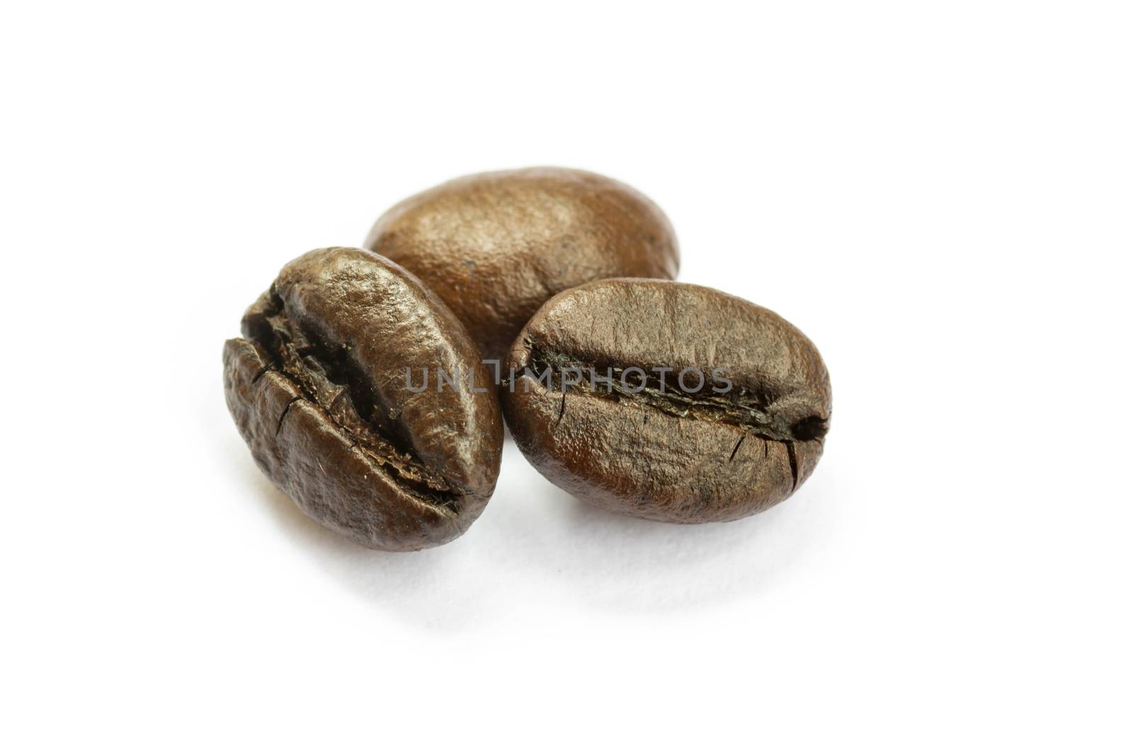 Coffee beans isolated on white by seksan44