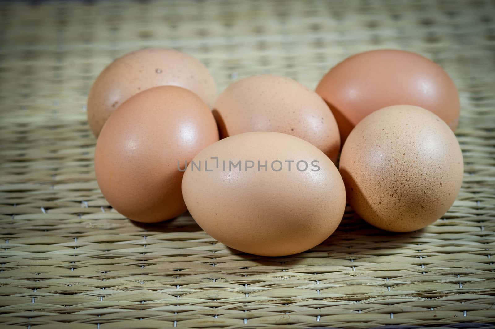 Chicken brown eggs on wood.