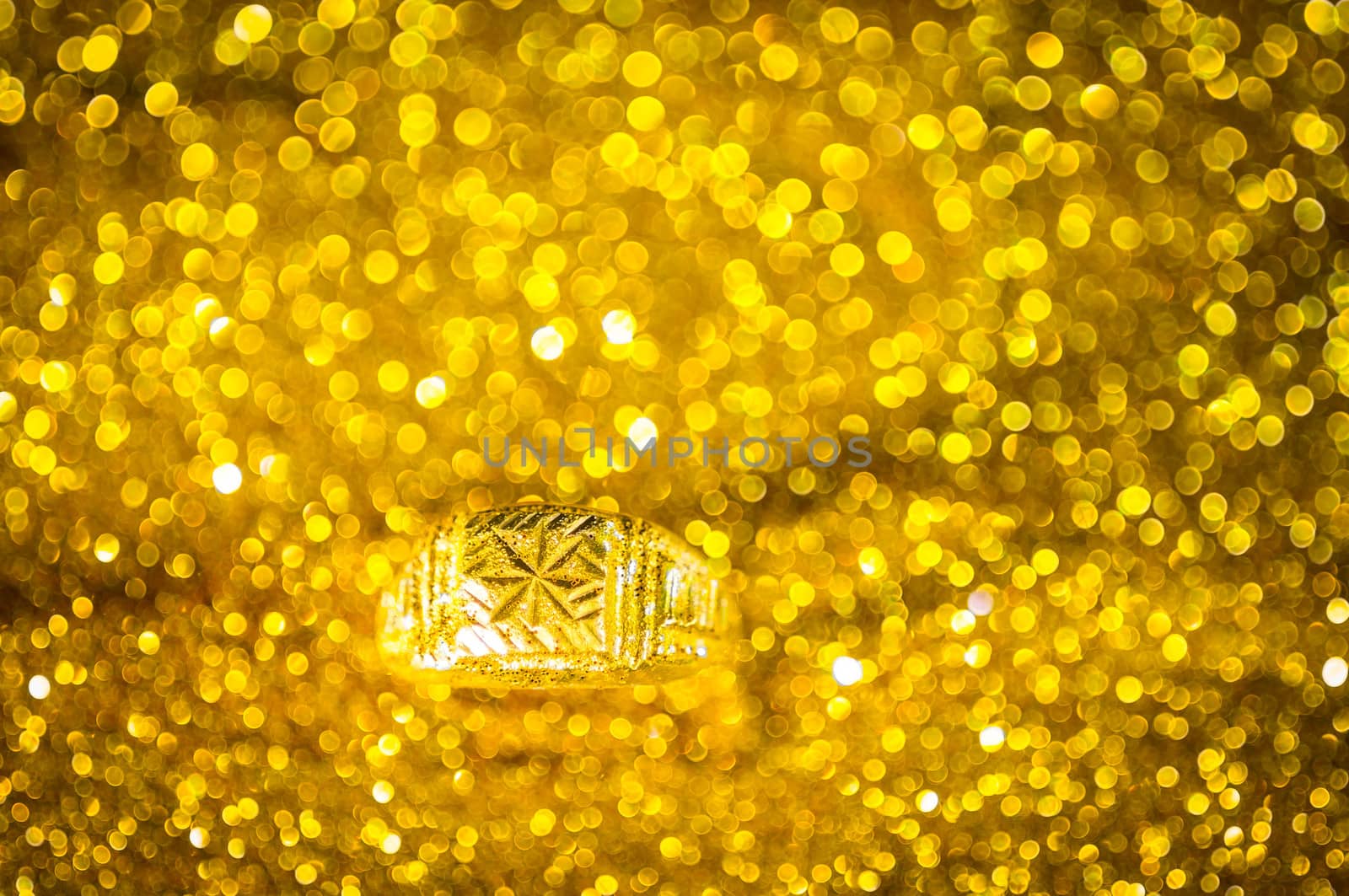 Golden Ring on bokeh gold colour abstract. by seksan44