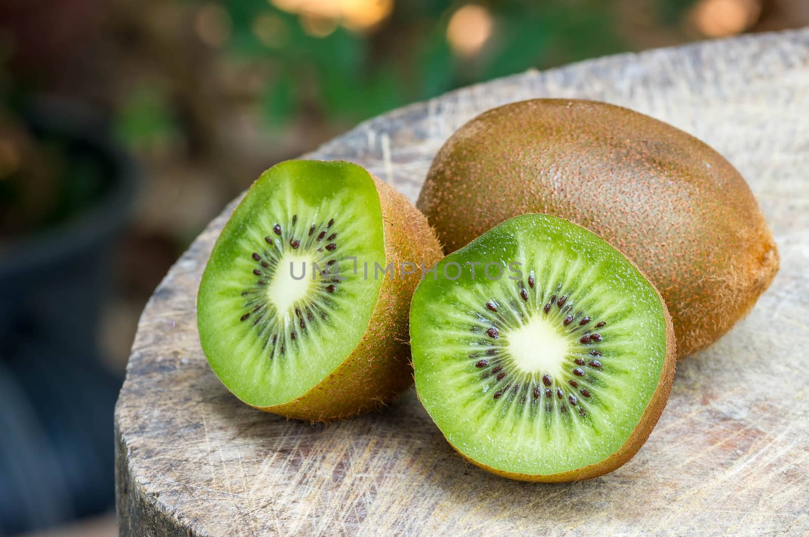 Kiwi fruit on wooden background
