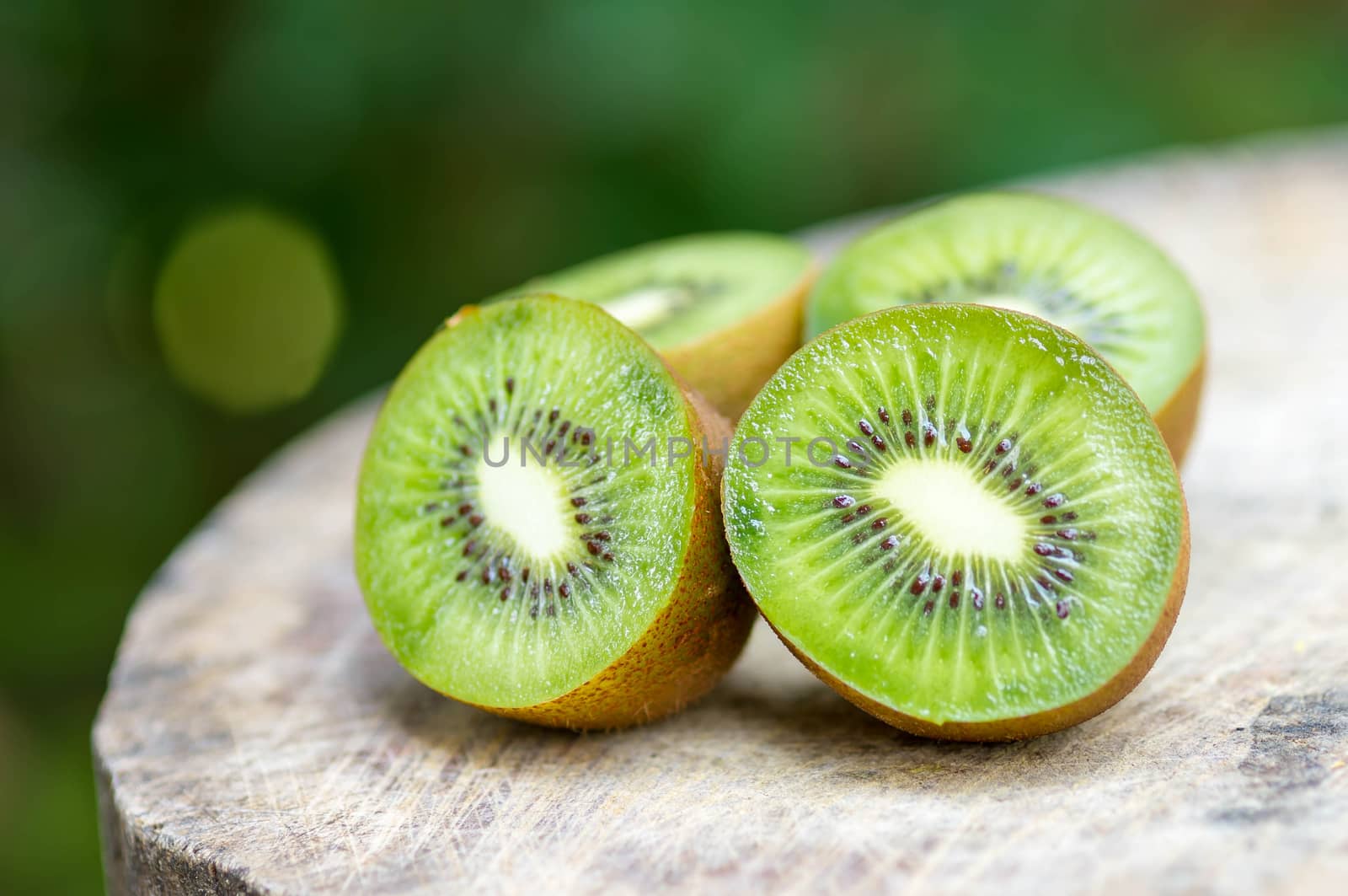 Kiwi fruit on wooden background