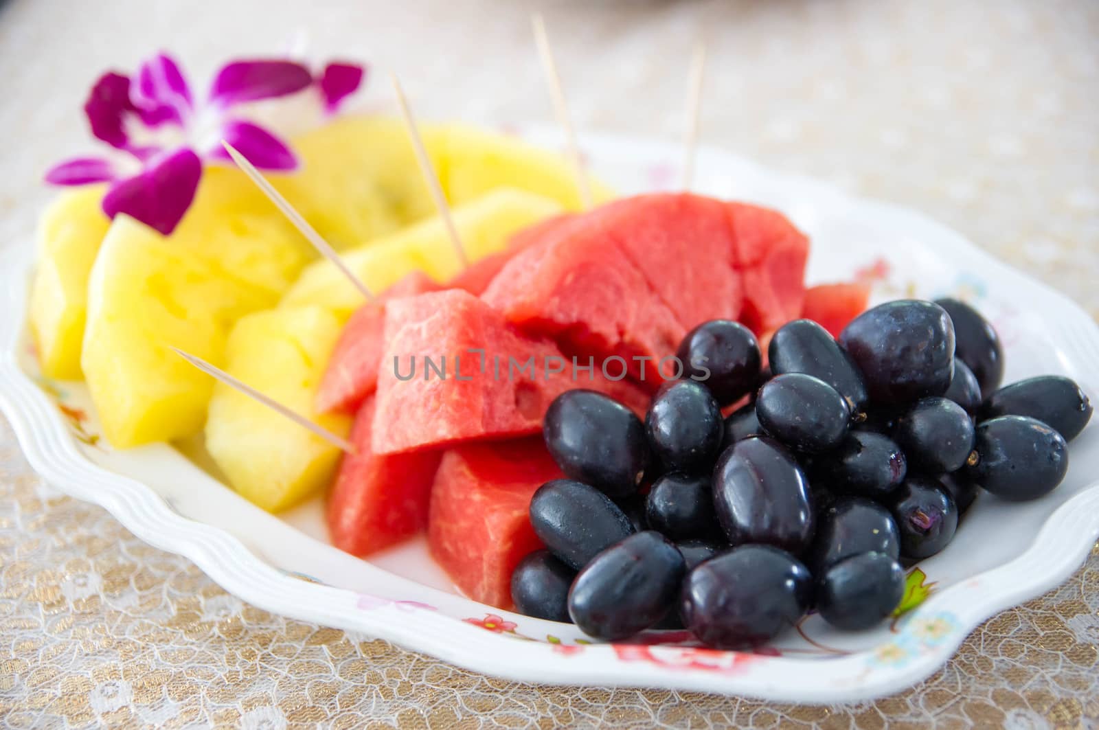 Mixed fruit in the dish on table.