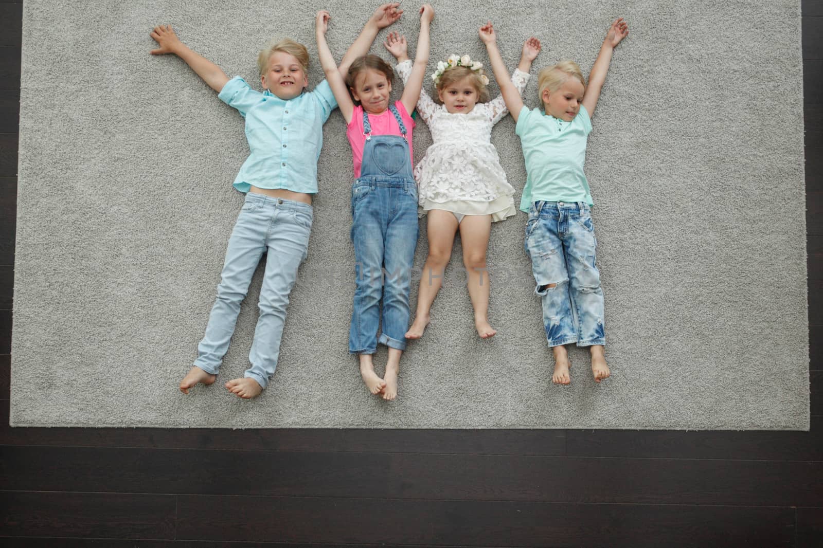 Kids laying on floor by ALotOfPeople