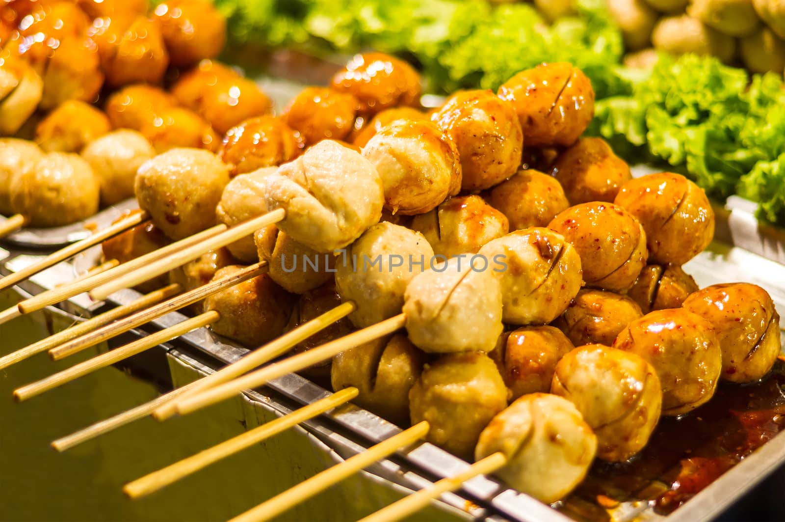 Many pork balls  with sauce. by seksan44