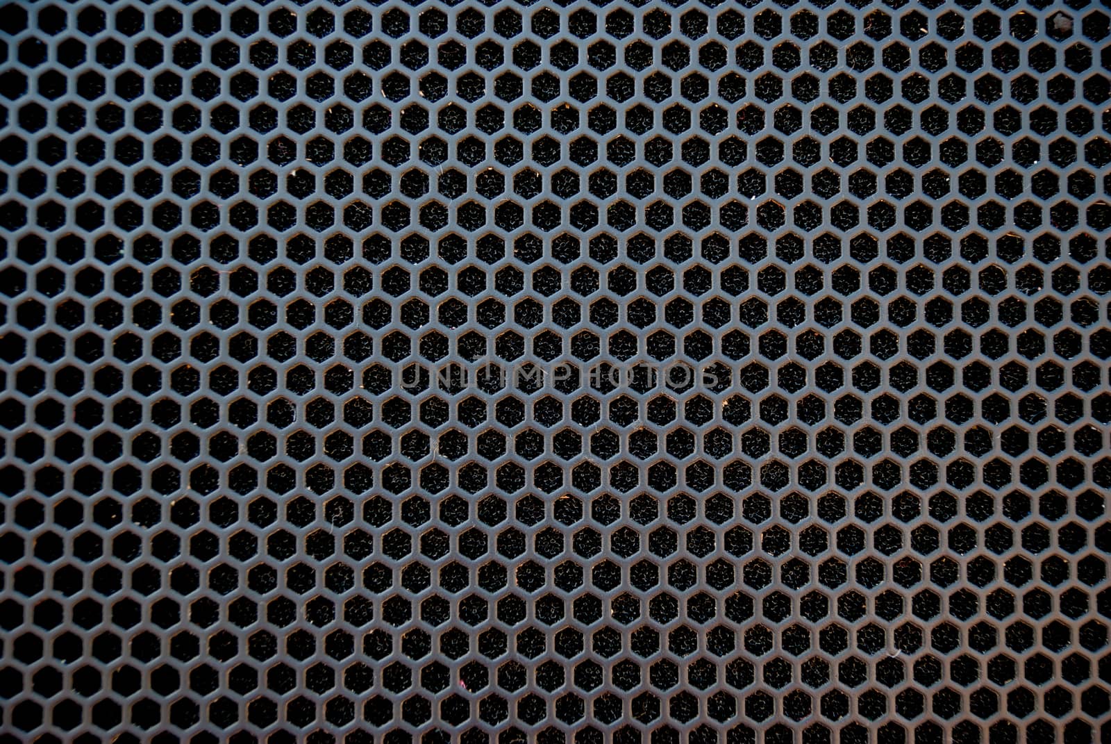 Black speaker grid texture. Industrial background.