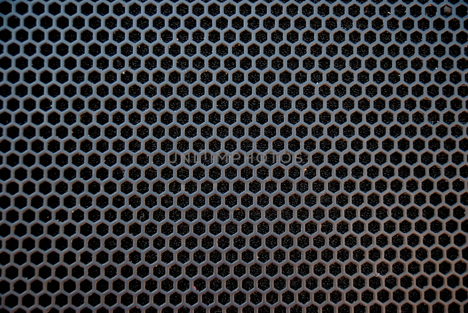 Black speaker grid texture. Industrial background.