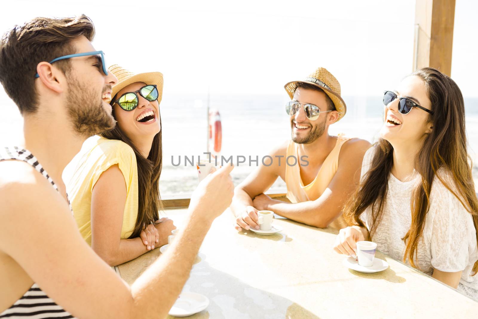 Fiends having a great time together at the beach bar