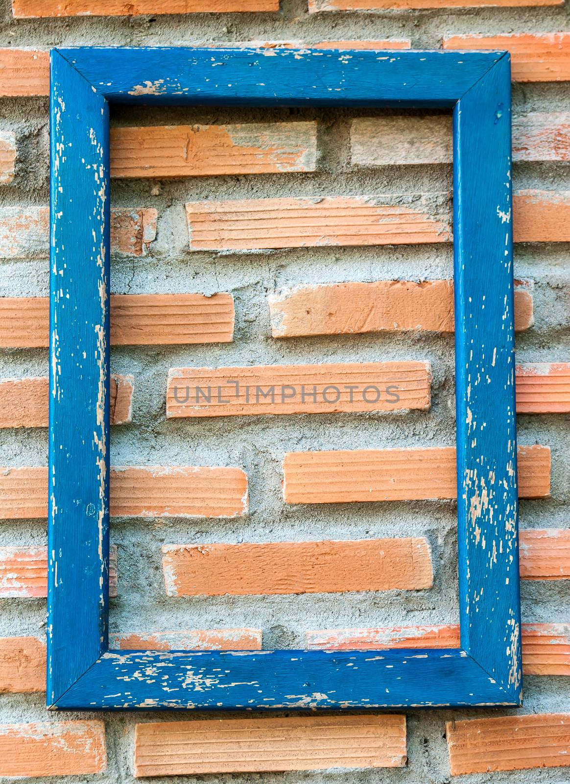 Old wood frames on brick wall.