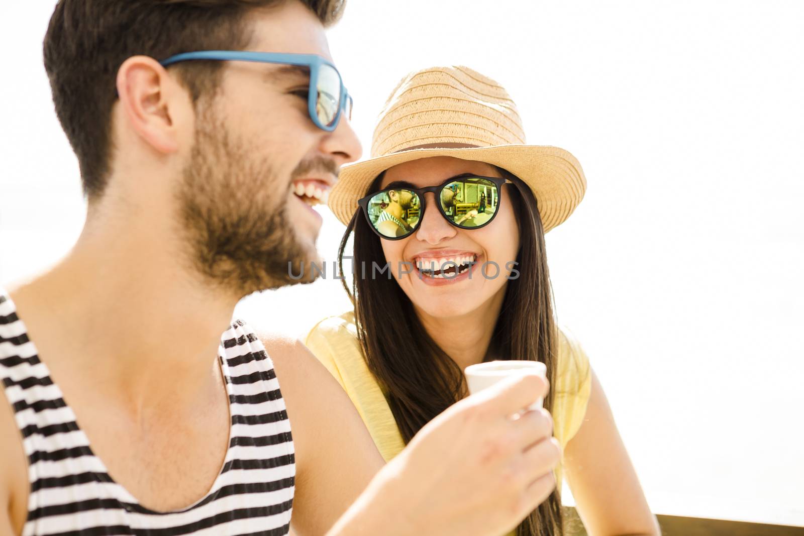 Fiends having a great time together at the beach bar